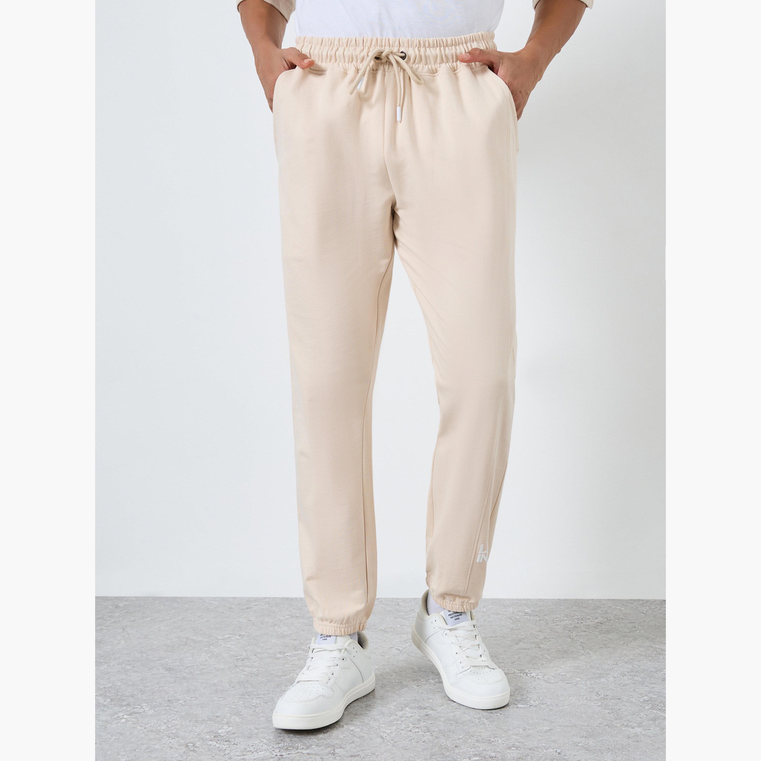 جوغر قصة ضيقة بطبعة أجزاء-men-clothing-bottoms-joggers-image-1