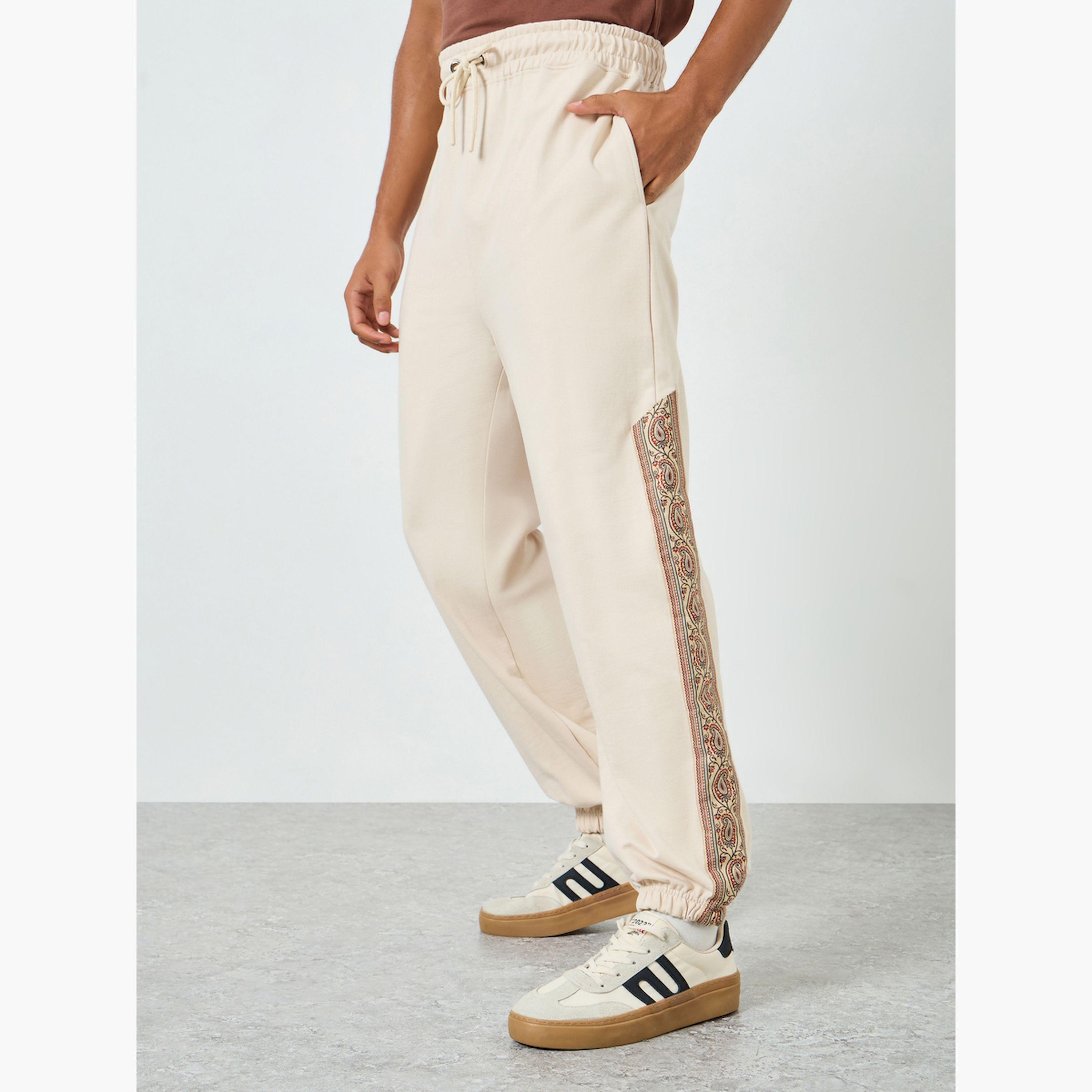 Styli Men Beige Printed Side Panel Joggers-men-clothing-bottoms-joggers-image-1