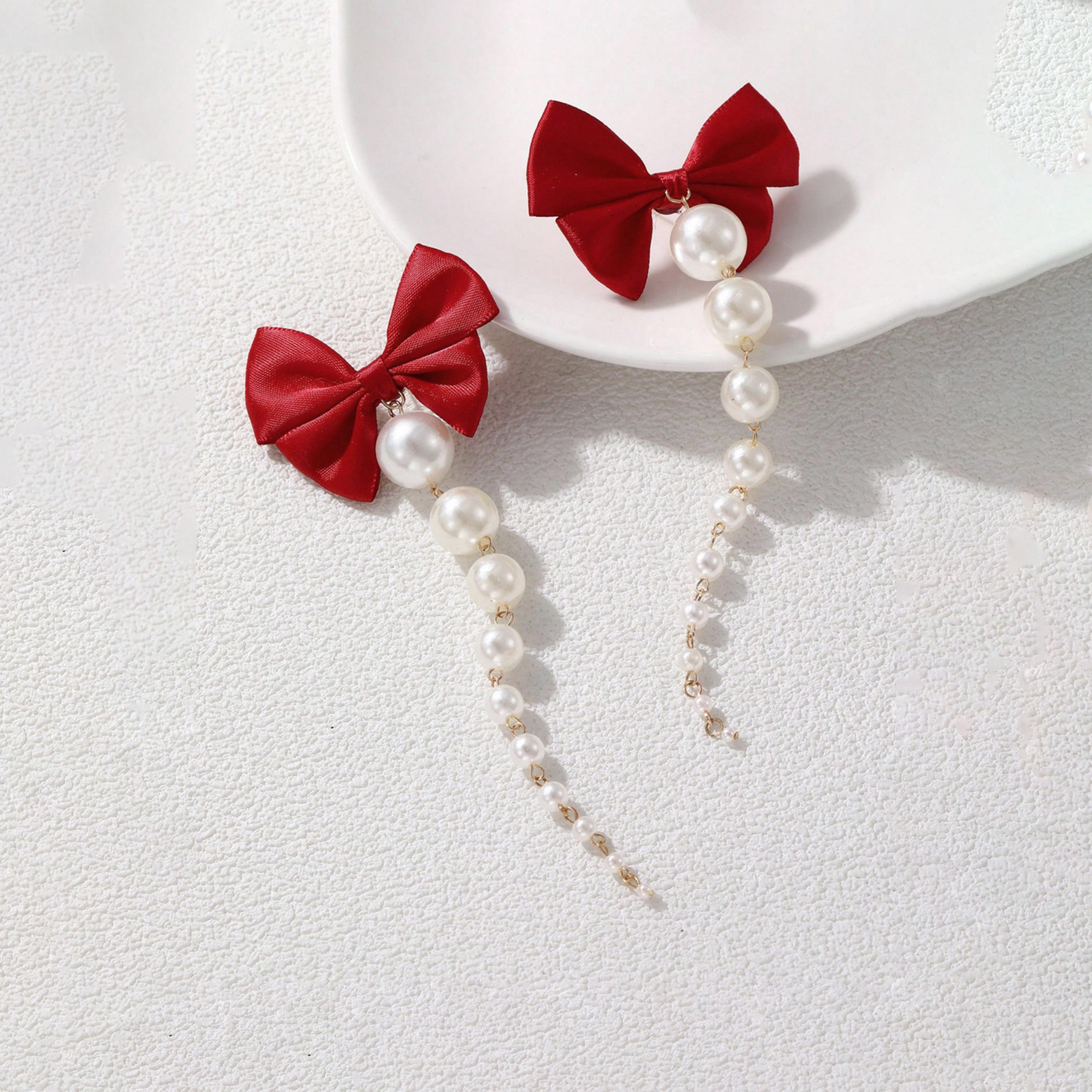 تيك تو - أقراط شراشيب من اللؤلؤ الصناعي على شكل فيونكة-women-watchesandjewellery-jewellery-earrings-image-1
