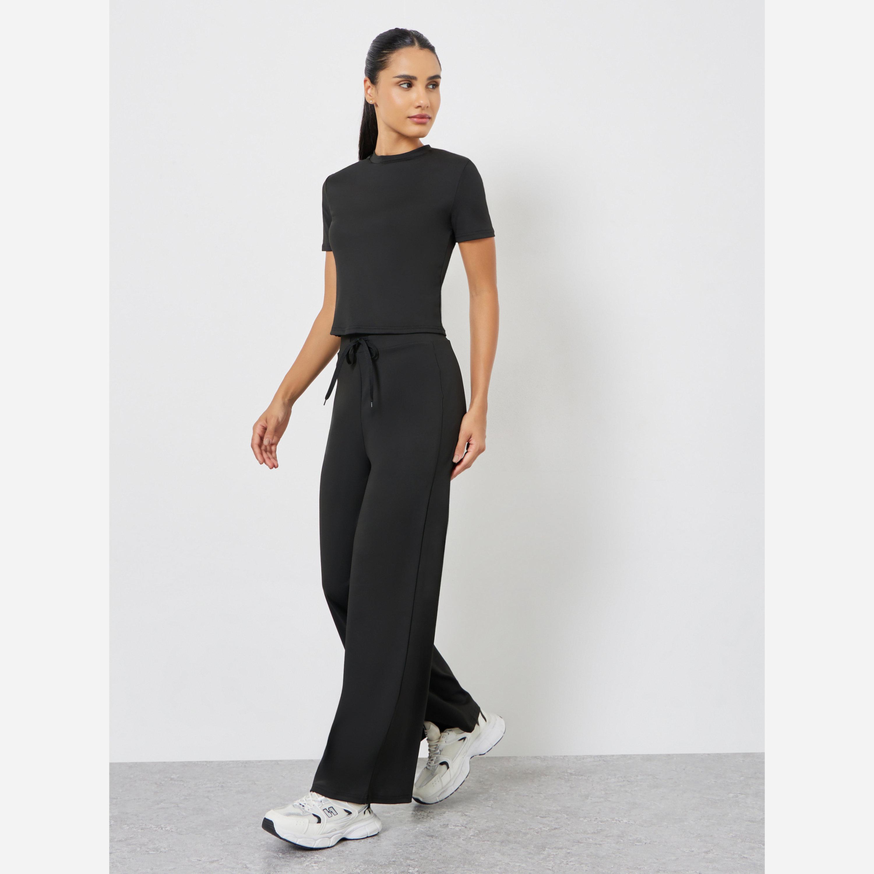 Styli Solid Crop Top and Drawstring Loose Pants Set-women-clothing-sportswearandactivewear-trackpantsandtracksuits-image-1