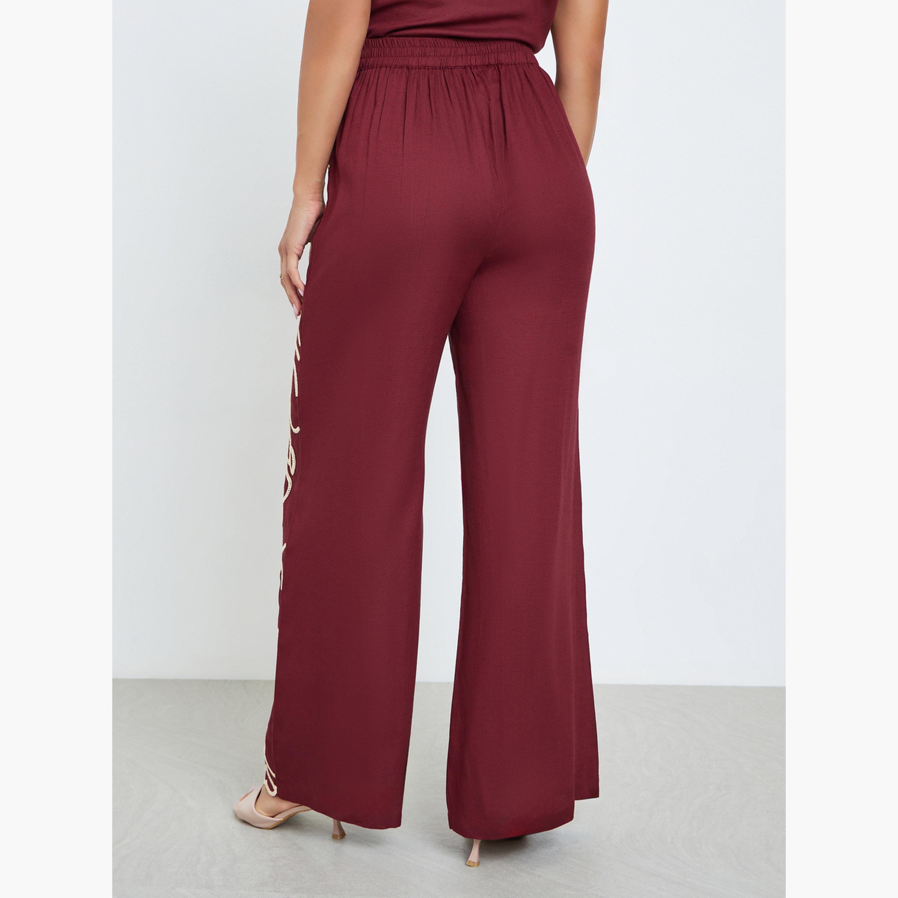 بنطال بأرجل واسعة وتفاصيل مُطرّزة-women-clothing-bottoms-trousers-image-3