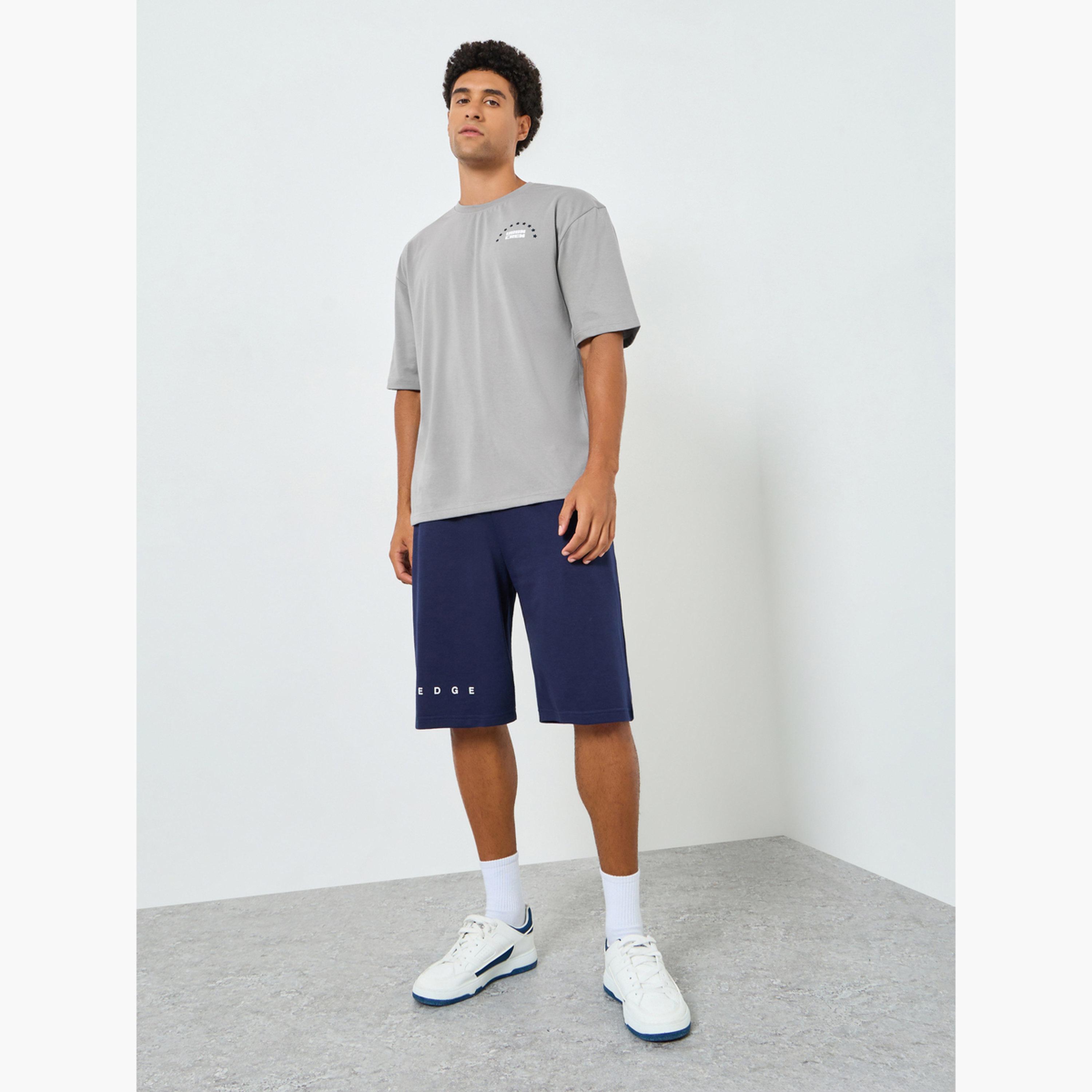 تيشيرت بقصة واسعة وطبعة جرافيك للرجال-men-clothing-tshirtsandpolos-polos-image-2