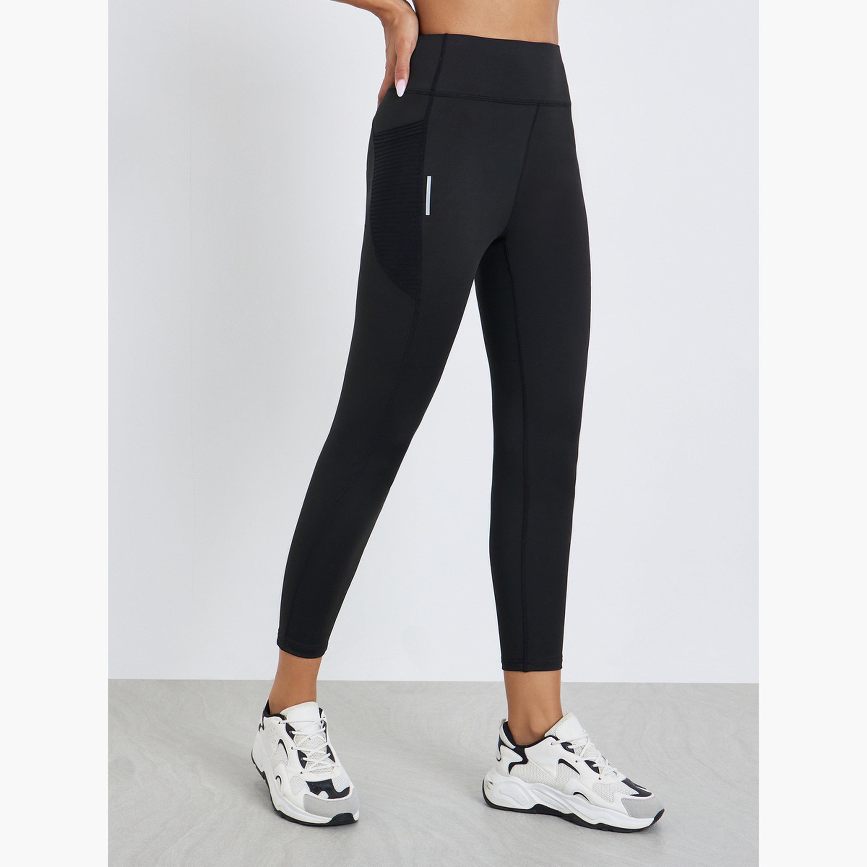 ليقنز بتفاصيل بارزة الملمس بطول 7/8 وأشرطة عاكسة-sports-women-clothing-joggersandtrackpants-image-1