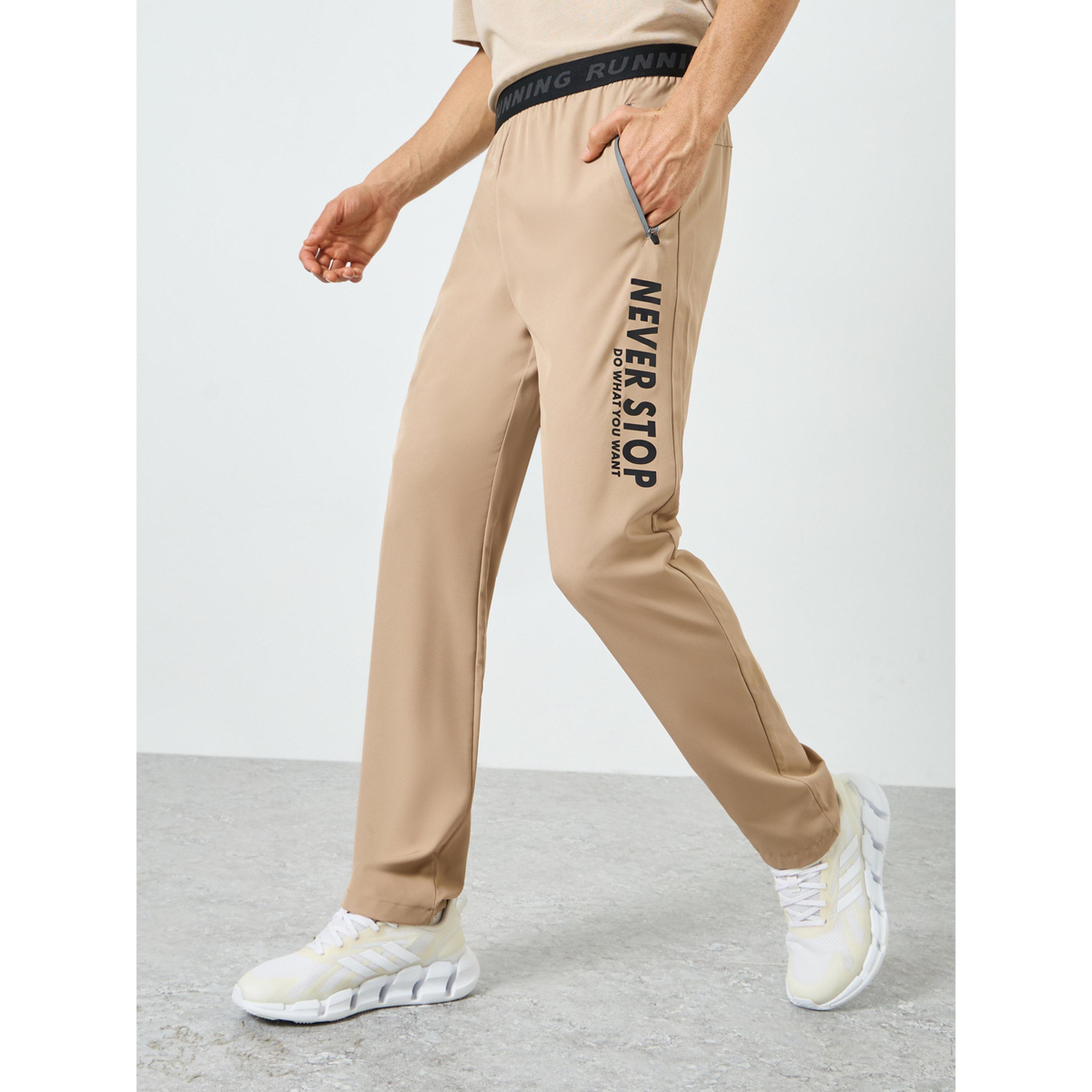 Styli Men Beige Graphic Training Track Pants-men-clothing-sportswearandactivewear-bottoms-joggers-image-1