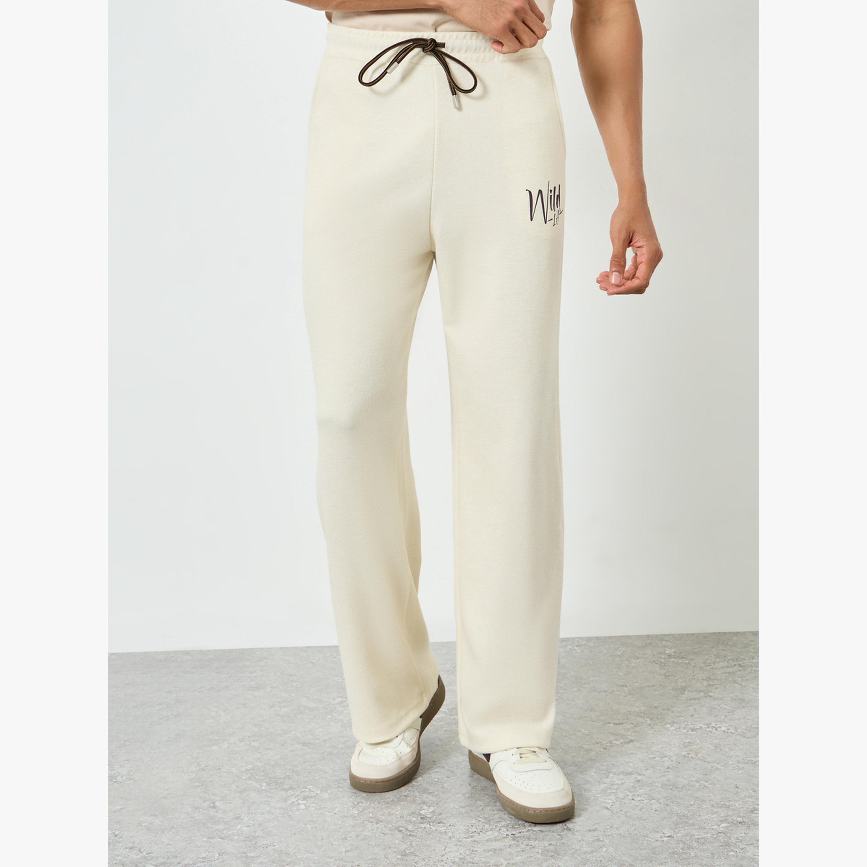 جوغر واسع بطبعة كتابة-men-clothing-bottoms-joggers-image-1