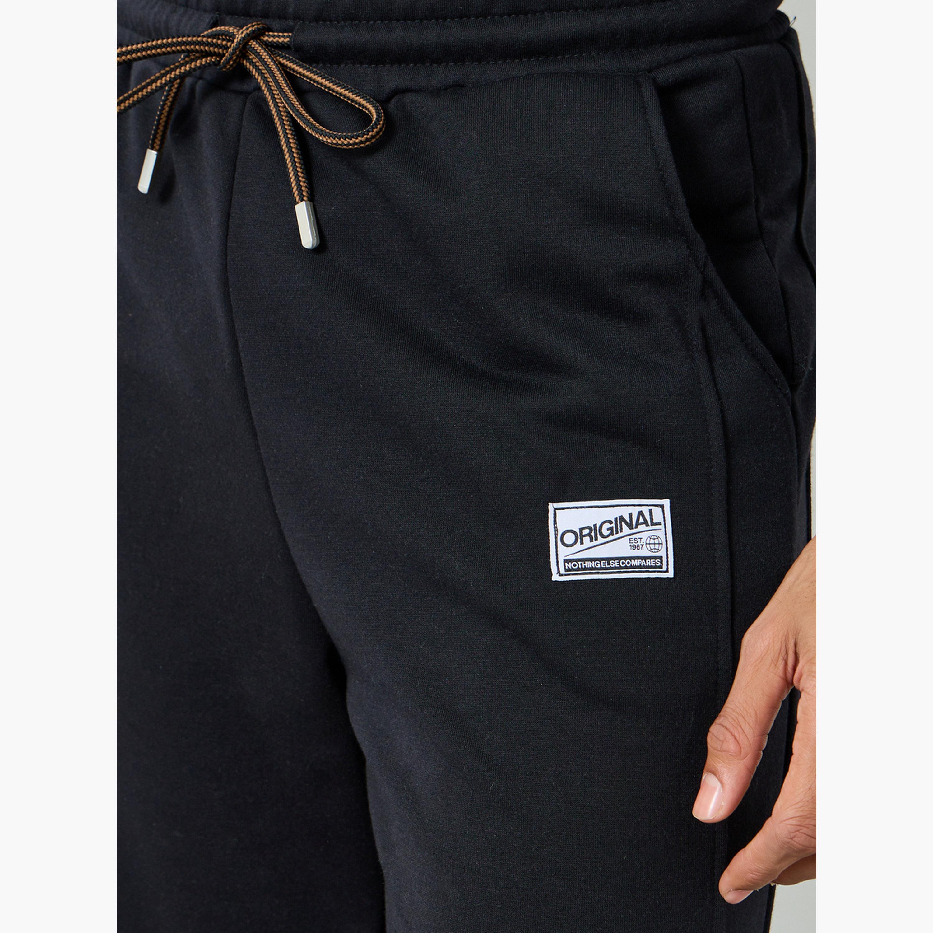 بنطال جوغر بحافة مطاطية وشعار وقصة مريحة-men-clothing-bottoms-joggers-image-4