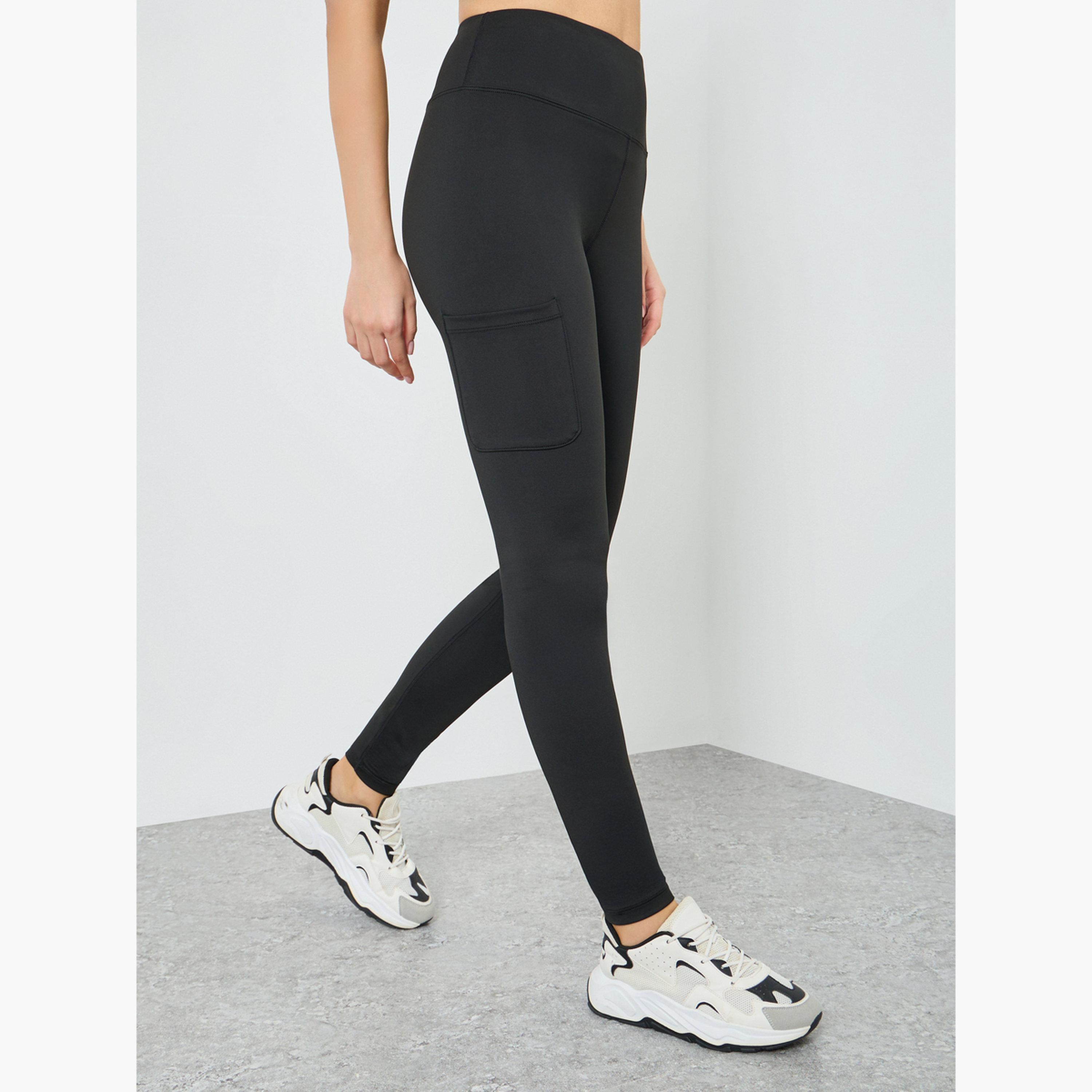 ليقنز بجيوب جانبية وشعار مطاطي عند الركبة-sports-women-clothing-joggersandtrackpants-image-1