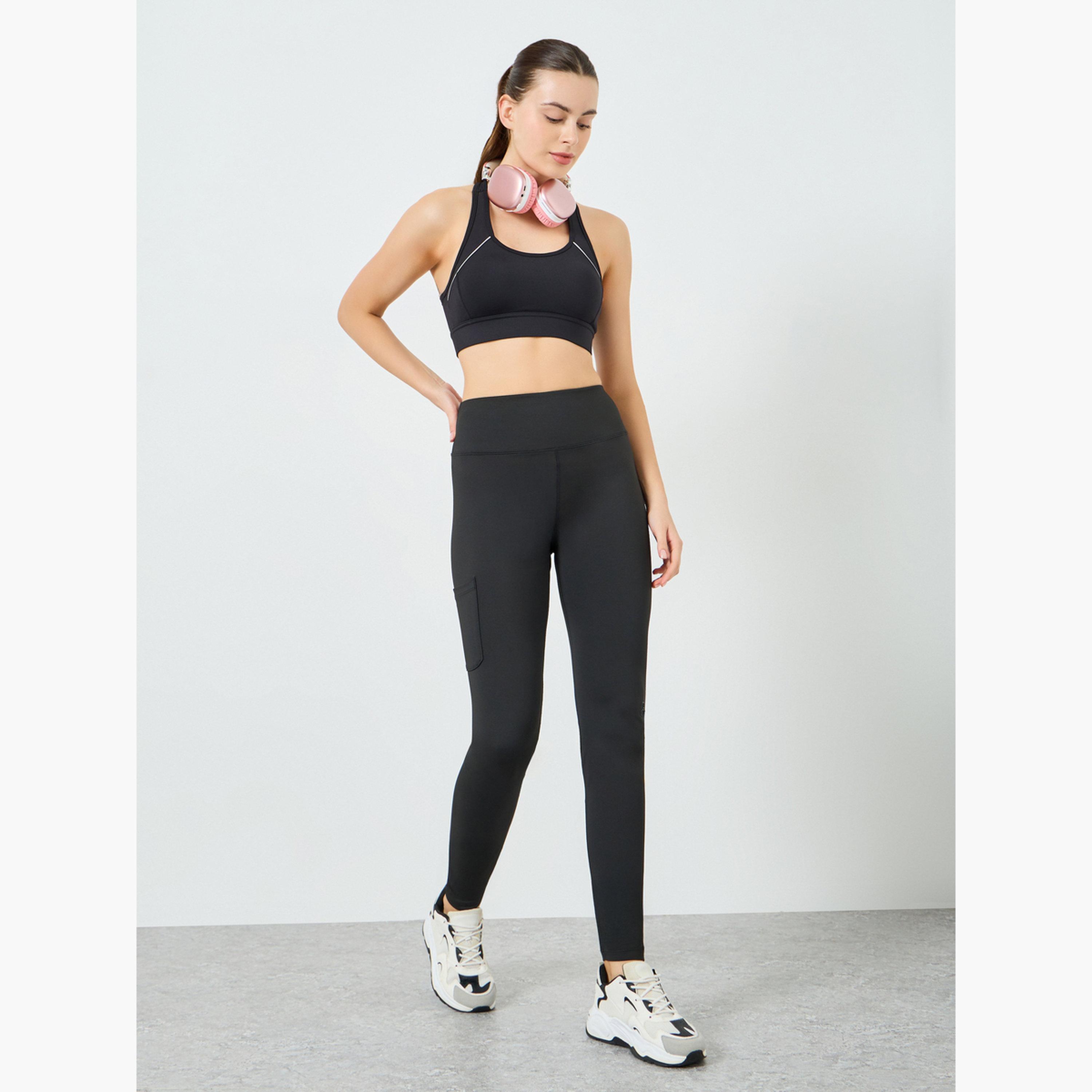 ليقنز بجيوب جانبية وشعار مطاطي عند الركبة-sports-women-clothing-joggersandtrackpants-image-2