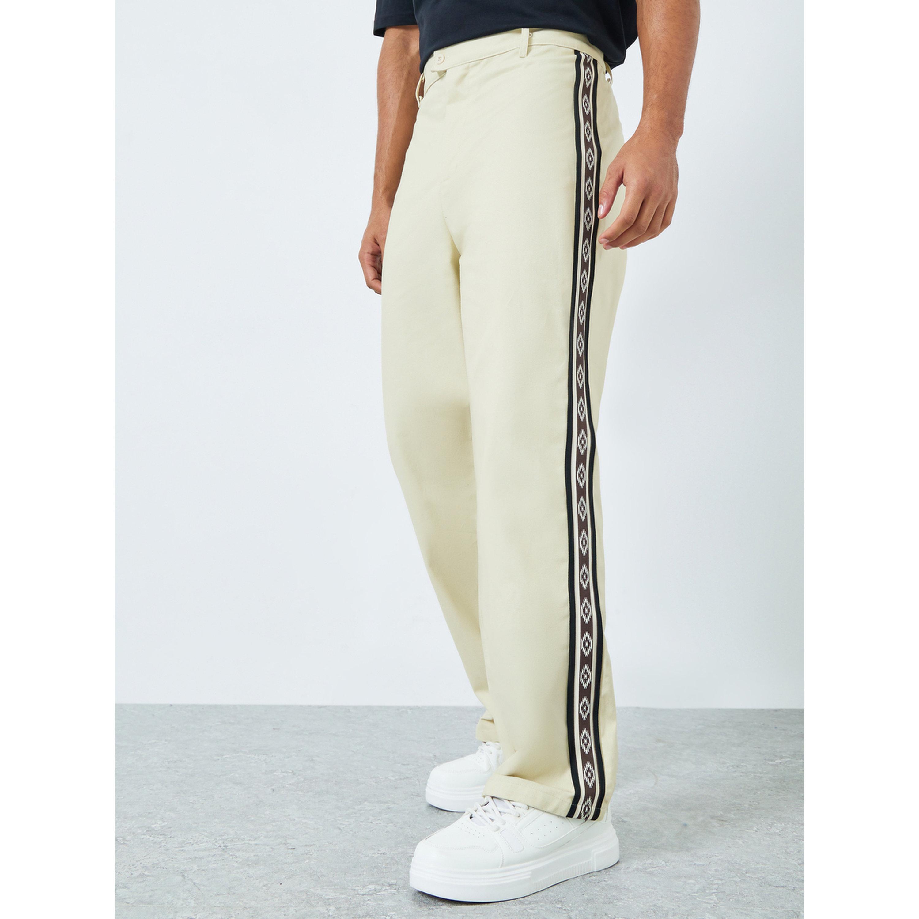 بنطال واسع بتفاصيل أشرطة-men-clothing-bottoms-trousersandchinos-trousers-image-1