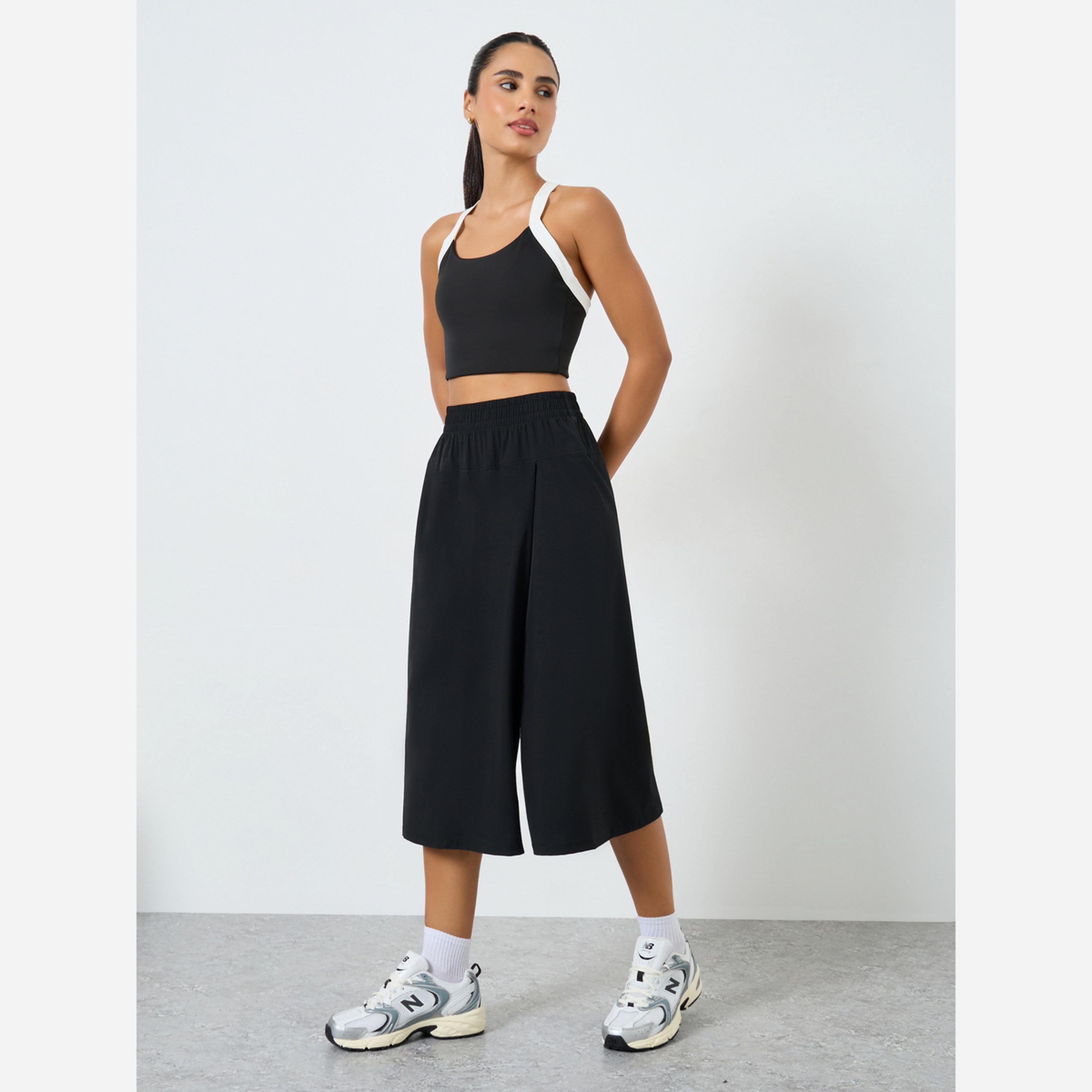 ستايلي - تنورة للنساء لون أسود بخصر مطاطي-women-clothing-sportswearandactivewear-bottoms-athleticskirtsandshorts-image-2