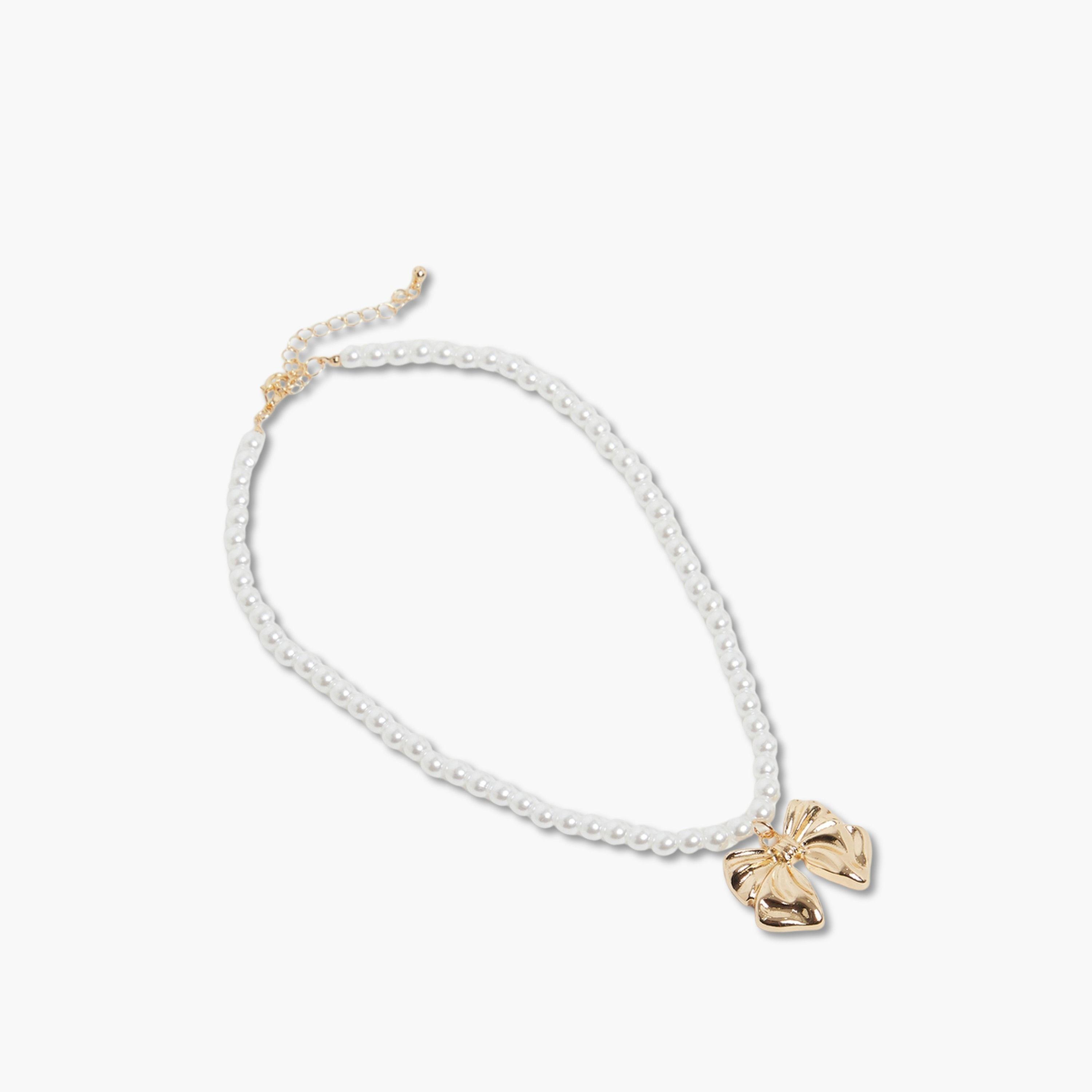 عقد مرصع باللؤلؤ مع فيونكة ذهبية-women-watchesandjewellery-jewellery-necklacesandpendants-image-1