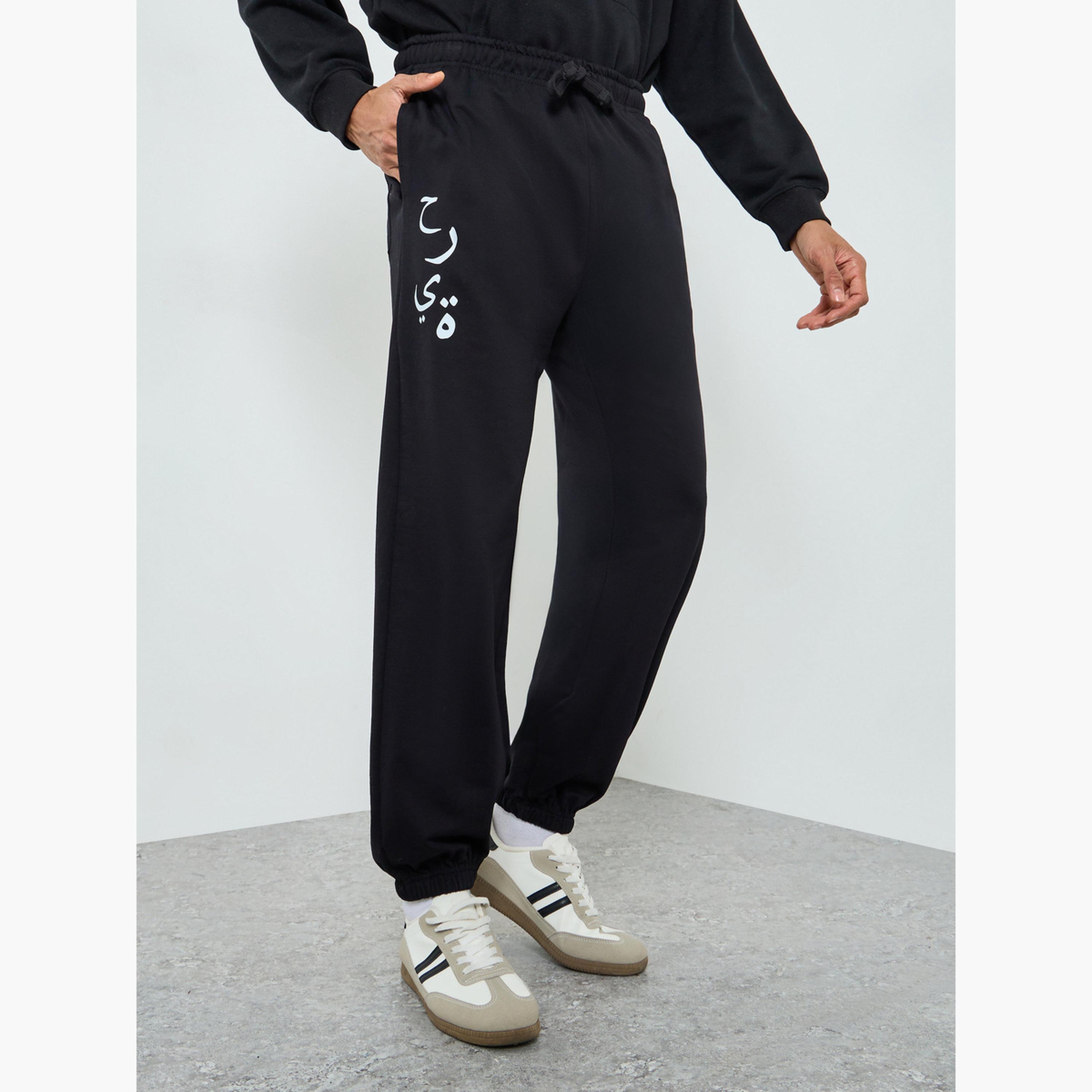 جوغر رجالي أسود بطبعة جرافيك-men-clothing-bottoms-joggers-image-1