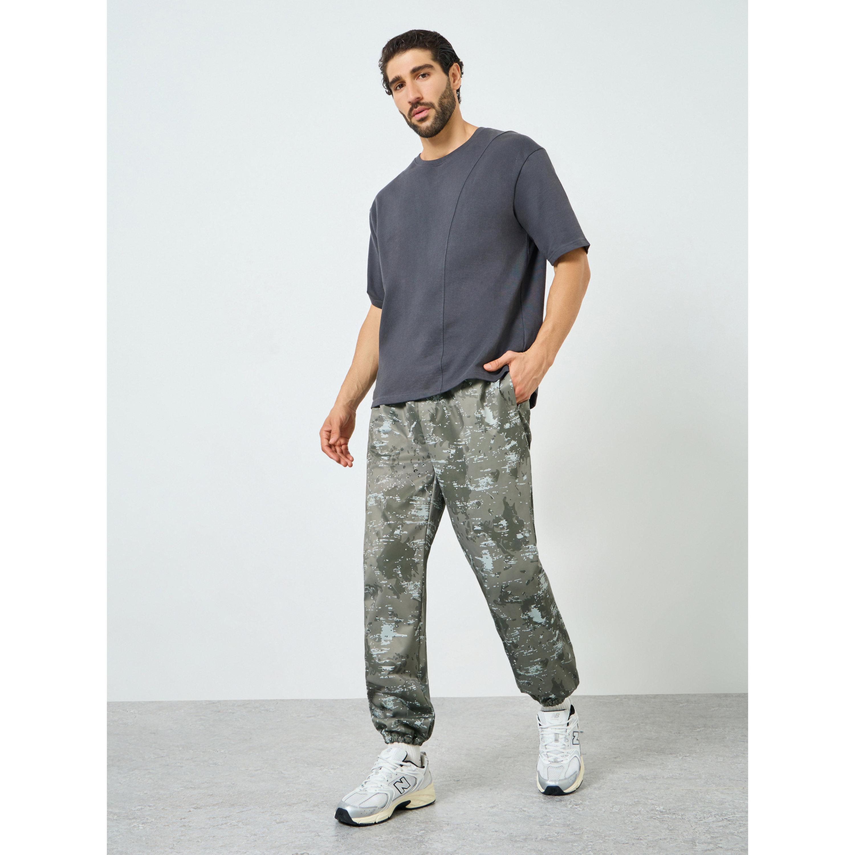 Styli Men Olive Printed Relaxed Track Pants-men-clothing-sportswearandactivewear-bottoms-joggers-image-2