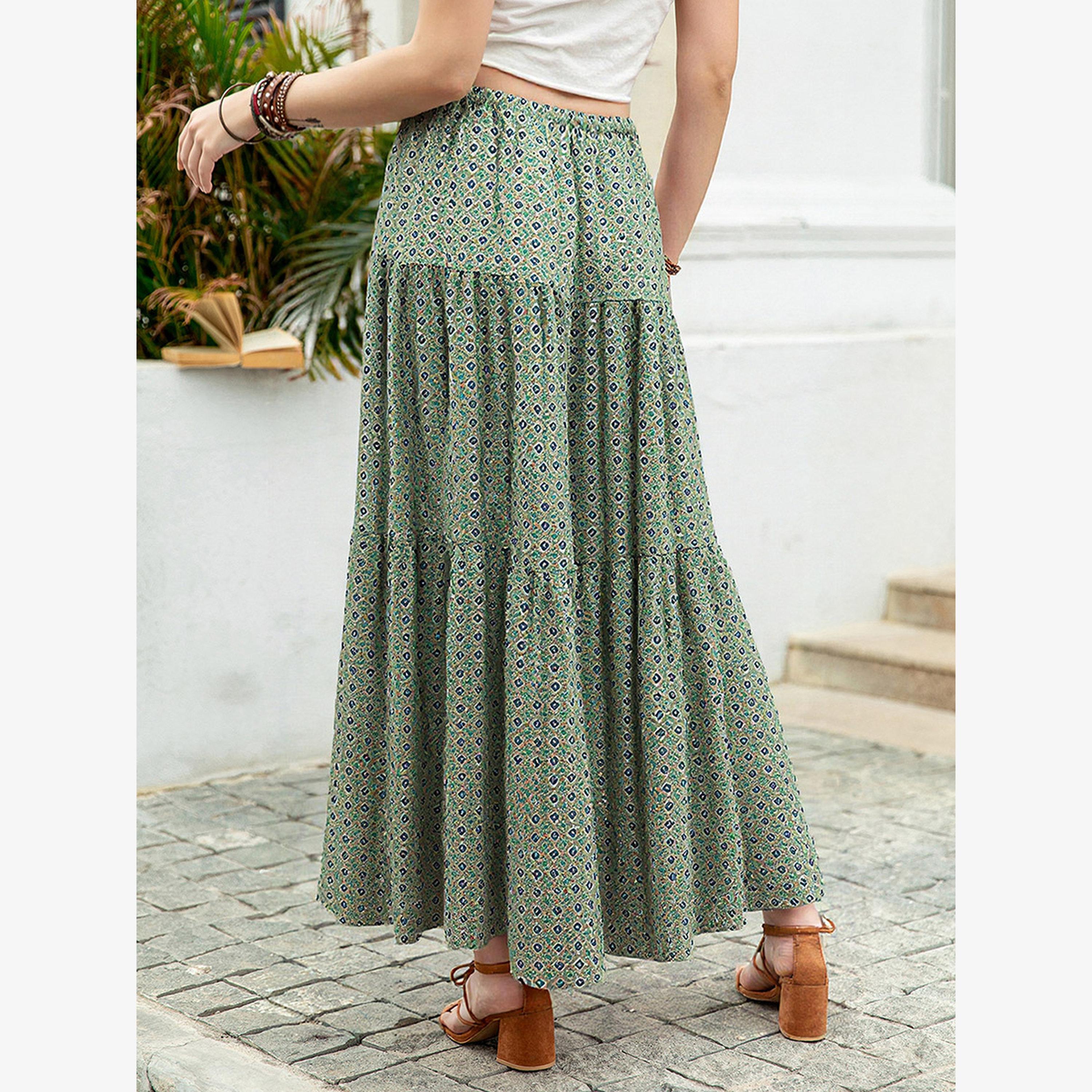 تنورة ميدي مطبوعة برسومات وتفاصيل مطوية-women-clothing-bottoms-skirts-image-5
