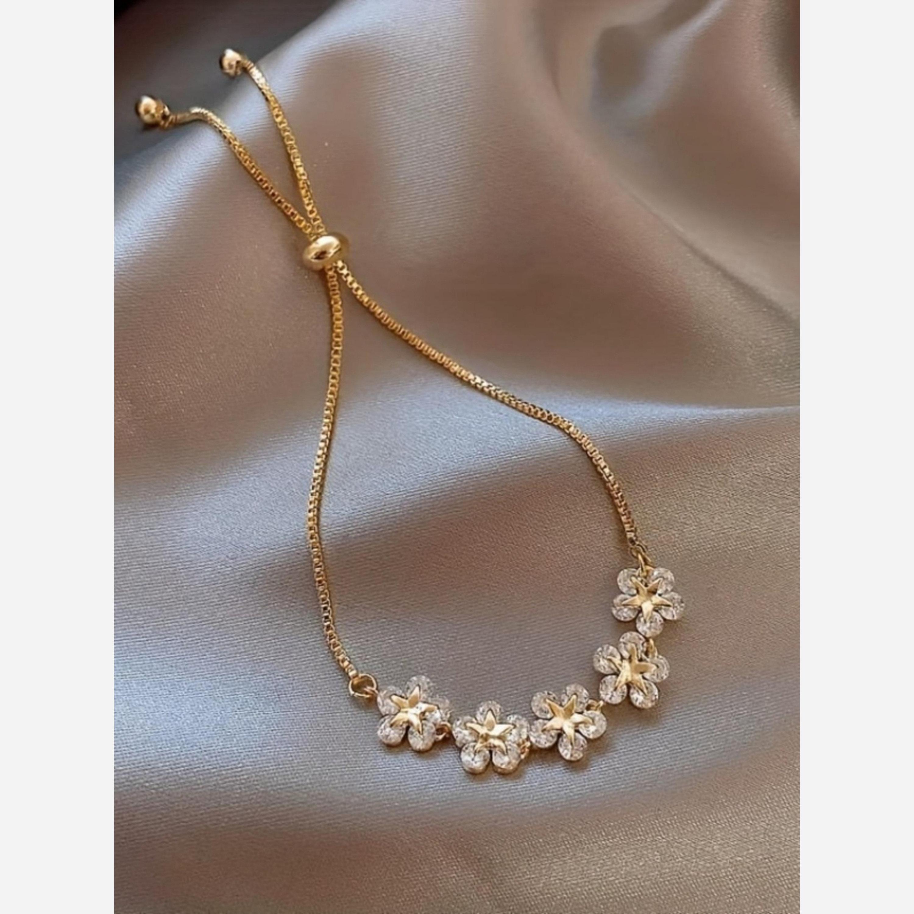 تيك تو - سوار مزين بتعليقة زهرة ذهبية-women-watchesandjewellery-jewellery-banglesandbracelets-image-3