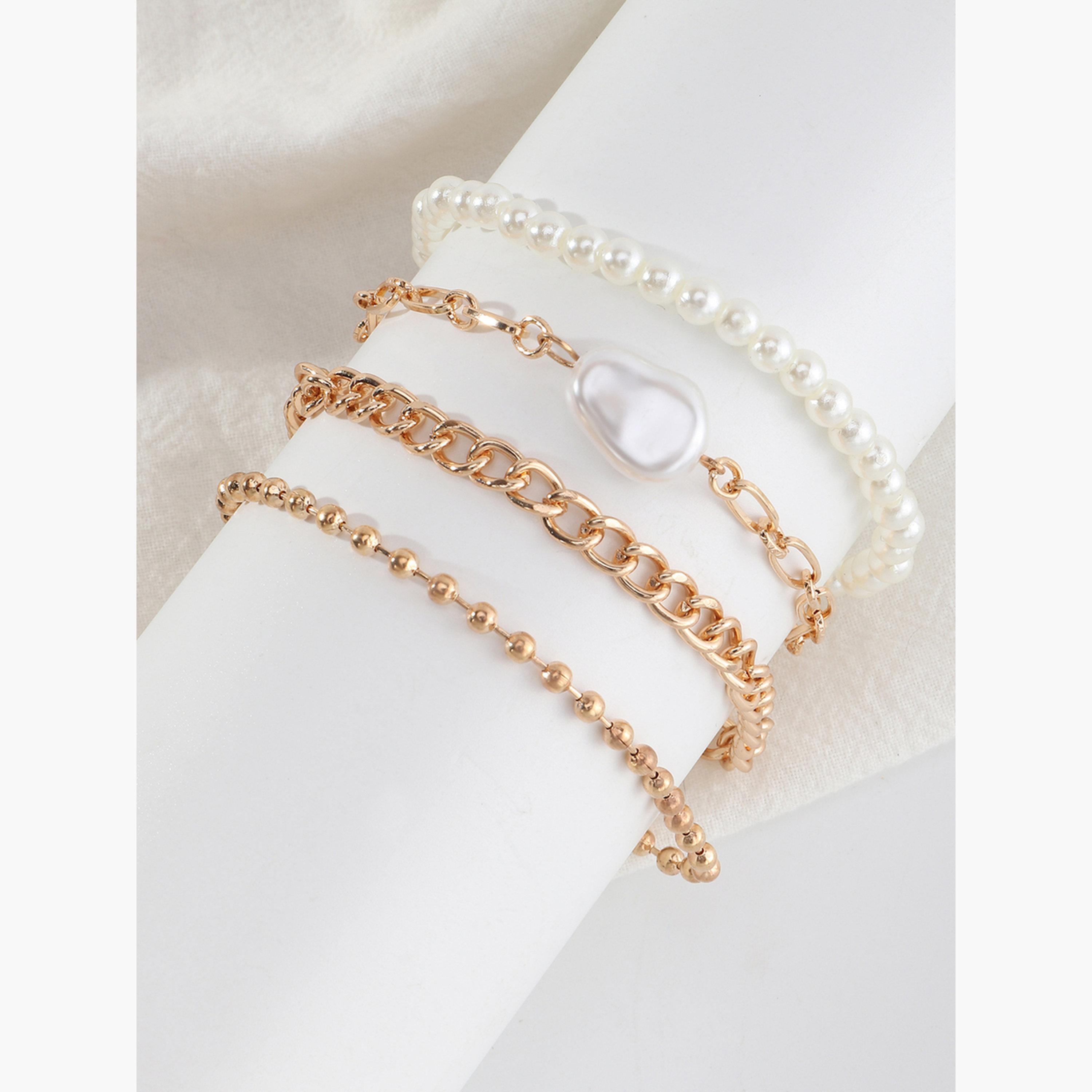مجموعة من 4 أساور يد مزينة بالخرز واللؤلؤ الصناعي-women-watchesandjewellery-jewellery-banglesandbracelets-image-4