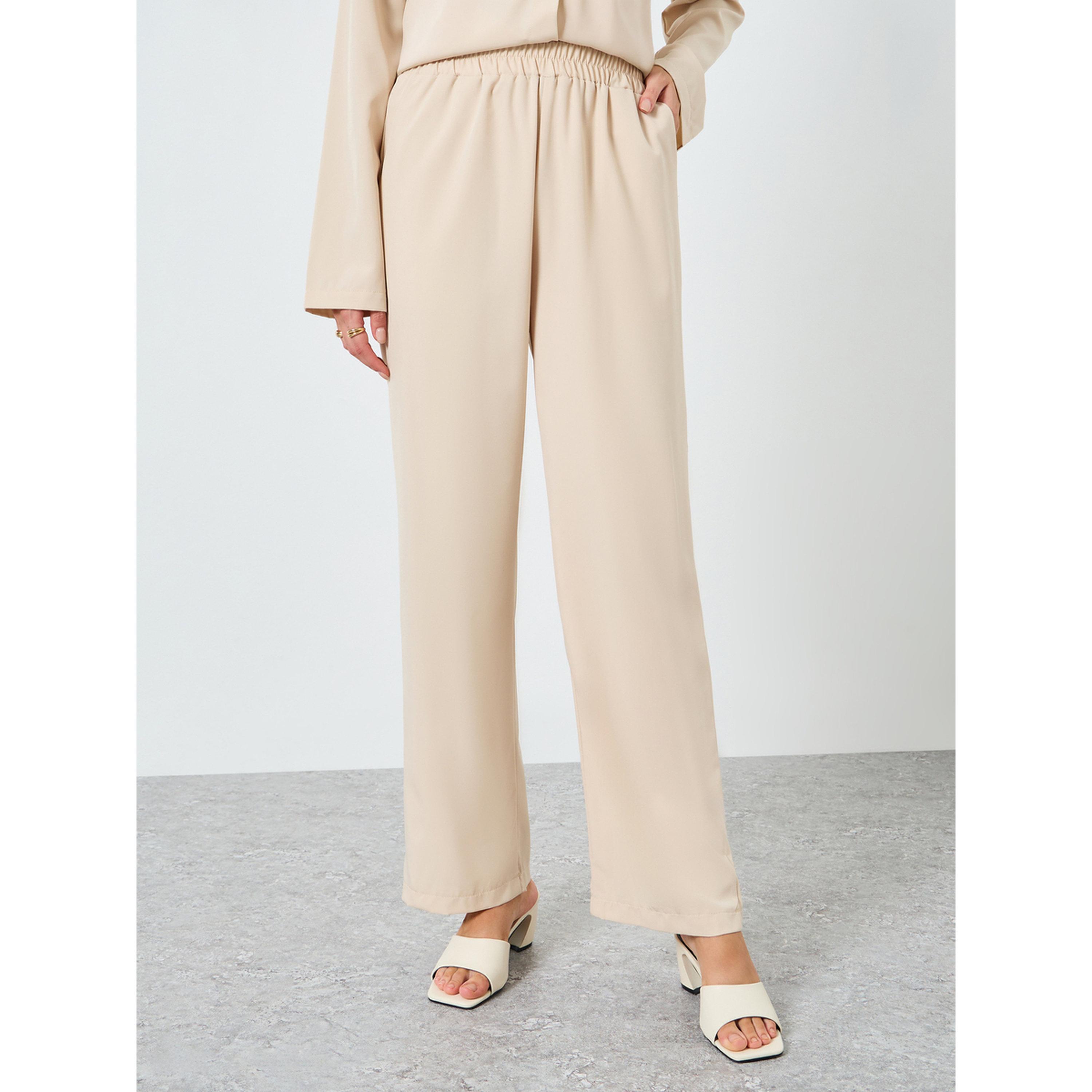 طقم منسق من بنطال بأرجل واسعة وبلوزة بحزام خصر-women-clothing-coordsets-image-4