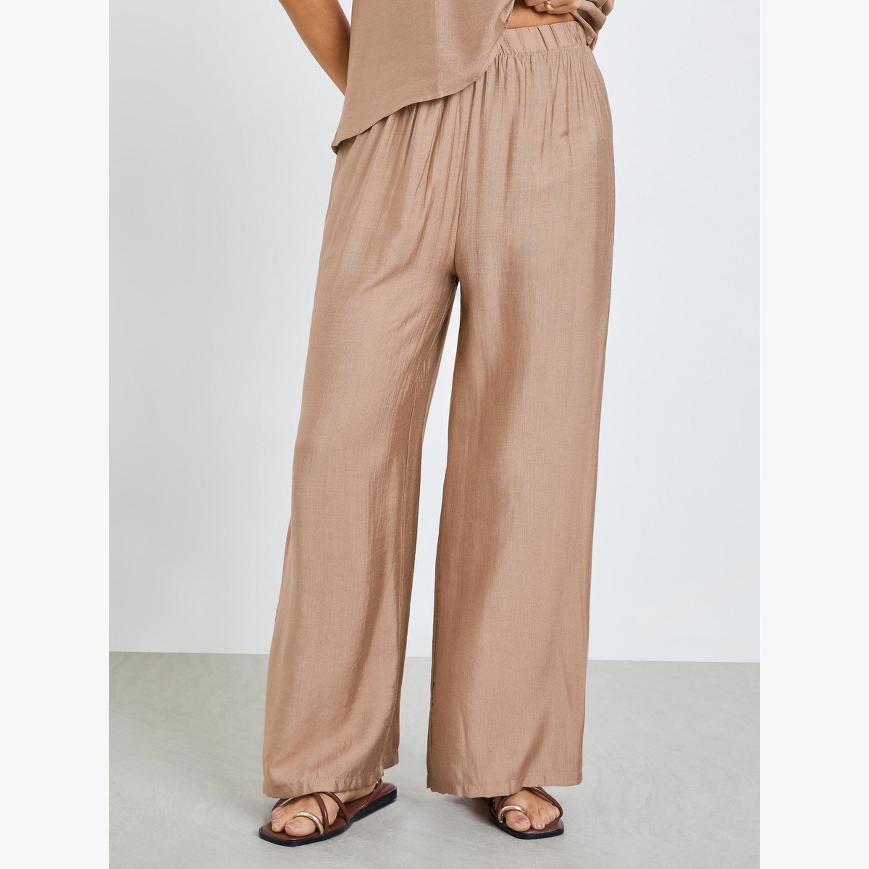 طقم منسق من بنطال بأرجل واسعة وبلوزة سادة-women-clothing-coordsets-image-4