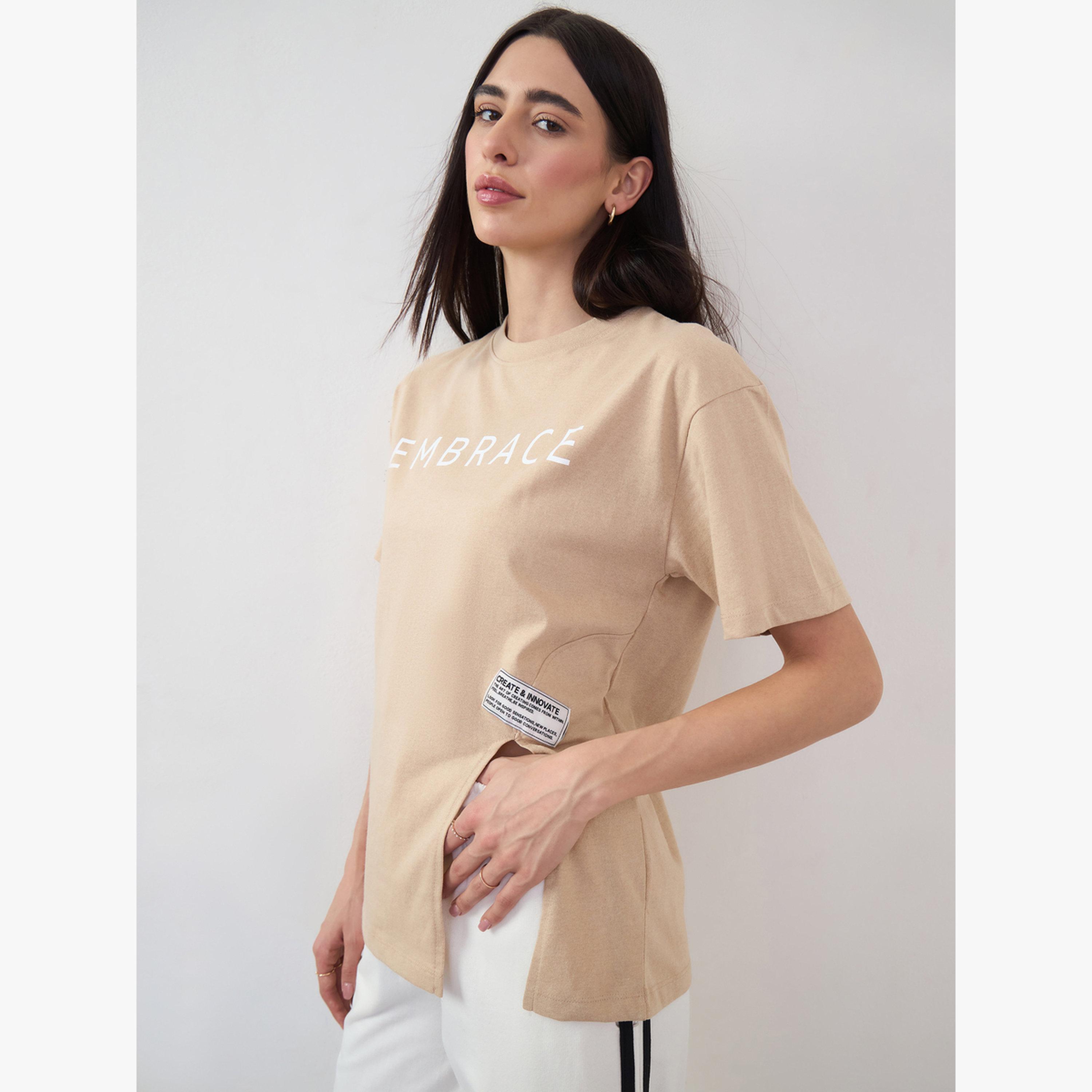 Styli Beige 100% Cotton Oversized T-Shirt with Slit and Badge Detail-women-clothing-tshirts-image-3