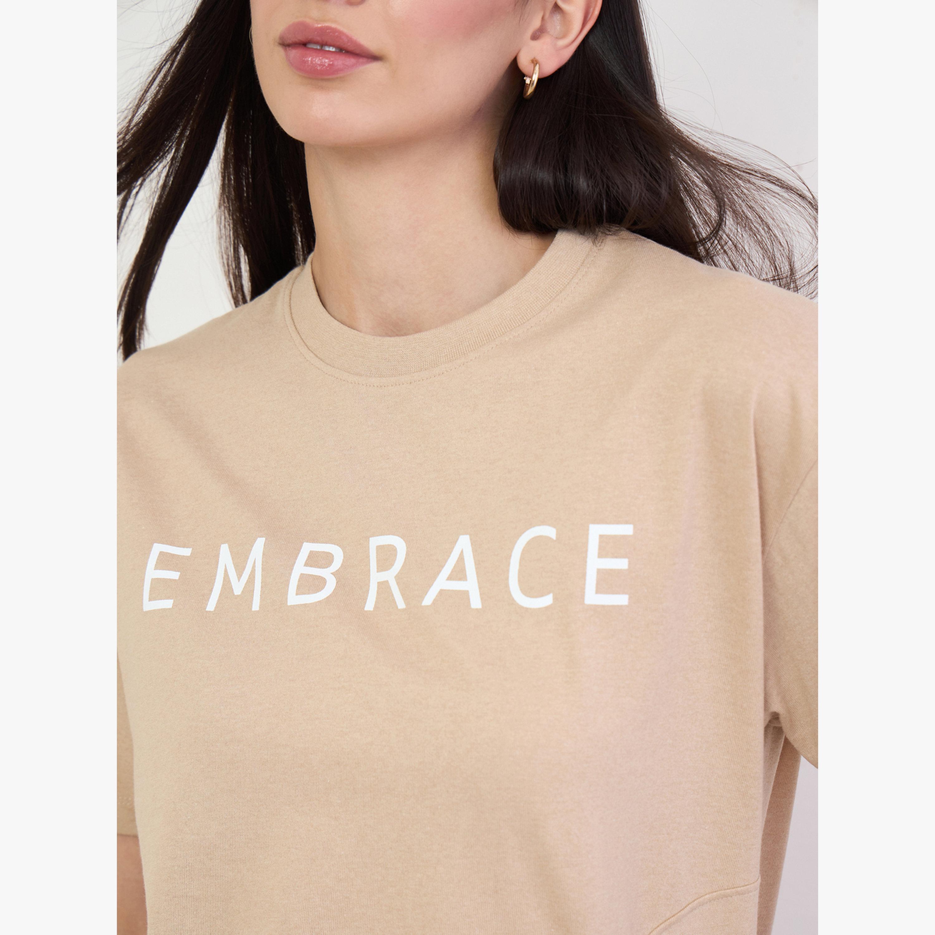 Styli Beige 100% Cotton Oversized T-Shirt with Slit and Badge Detail-women-clothing-tshirts-image-6