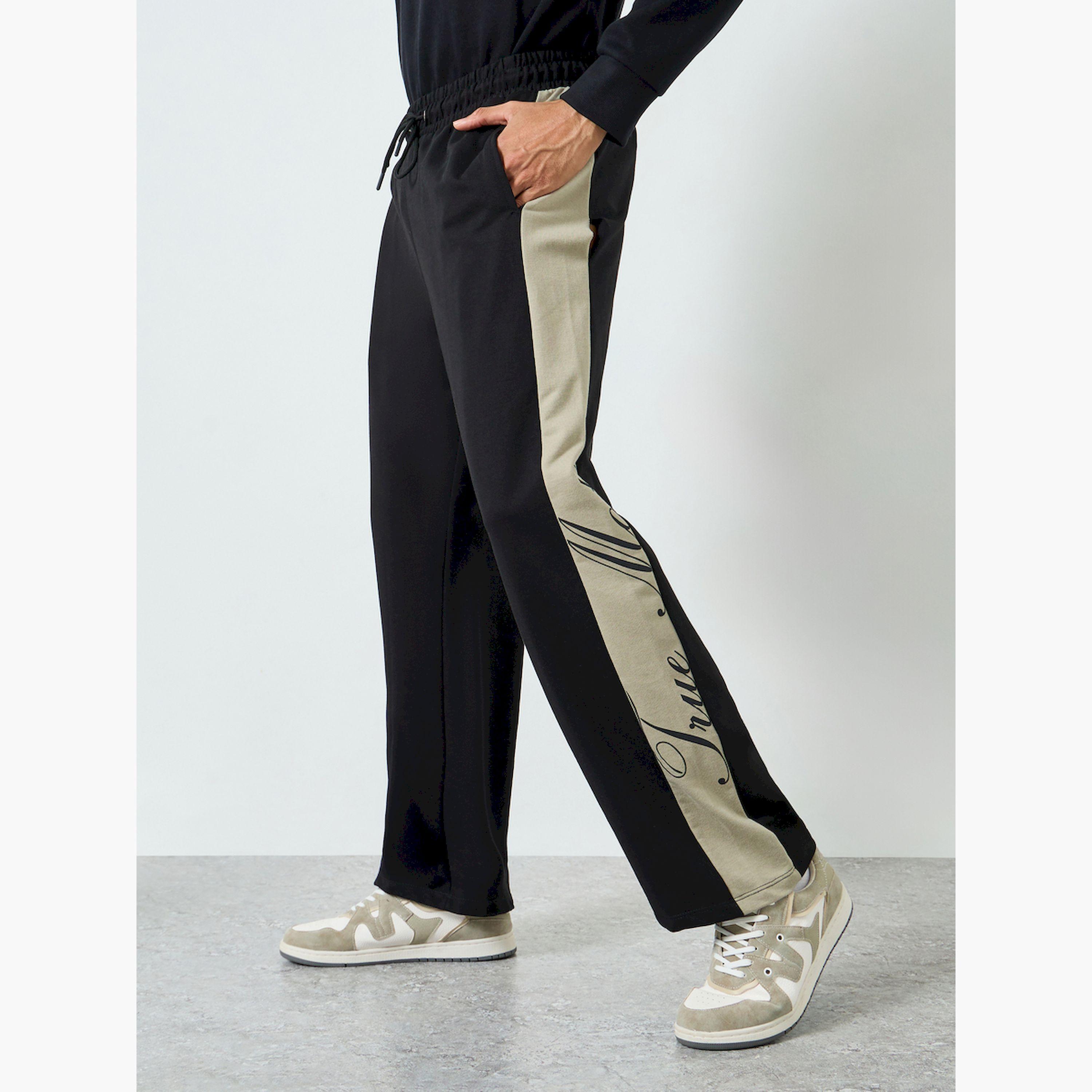 جوغر رجالي أسود بتفاصيل خطوط جانبية-men-clothing-bottoms-joggers-image-1