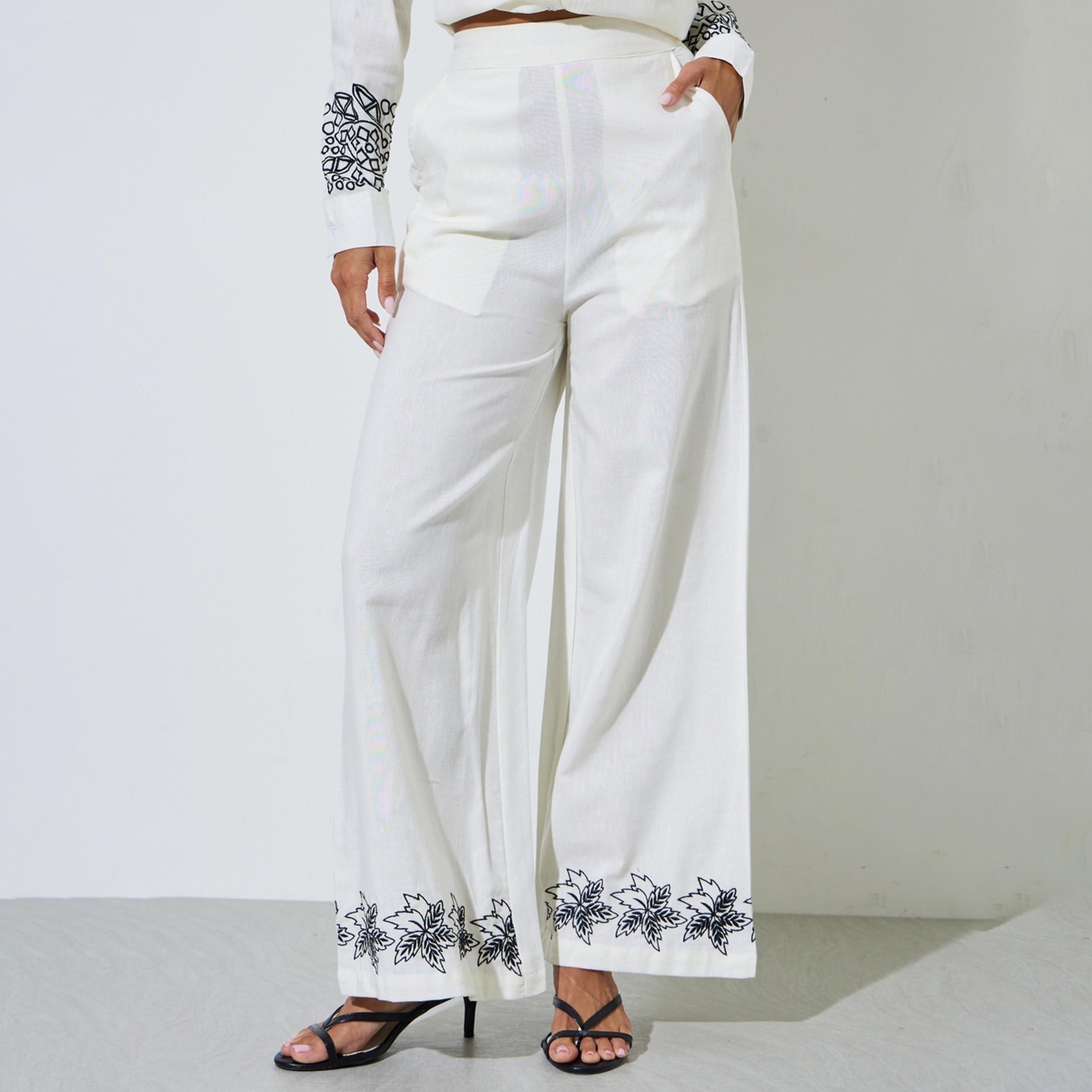 بنطال بأرجل واسعة وحافة مطرزة لون أوف وايت-women-clothing-bottoms-joggers-image-1