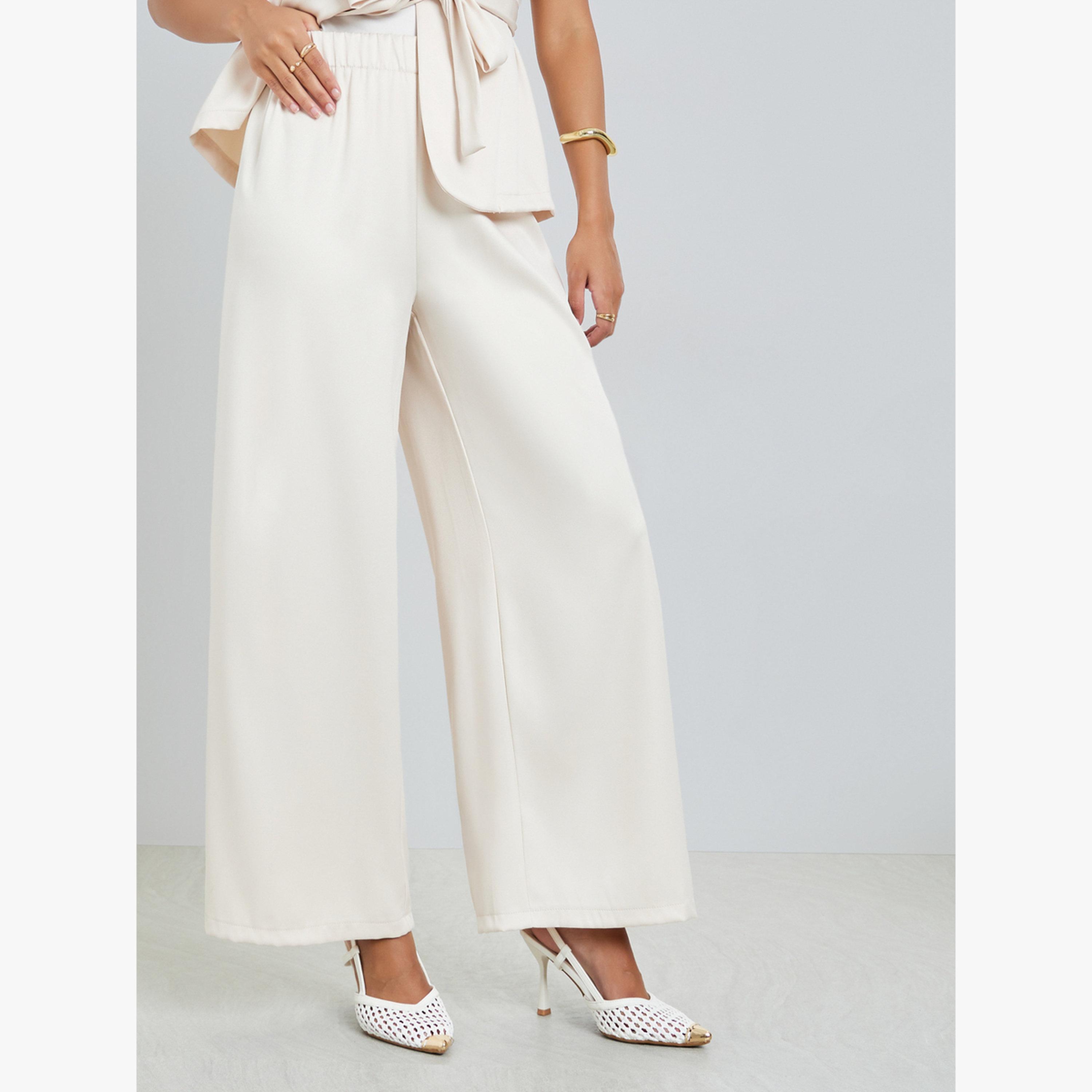 طقم منسق من بنطال بأرجل واسعة وفيست بليزر برباط خصر-women-clothing-coordsets-image-4