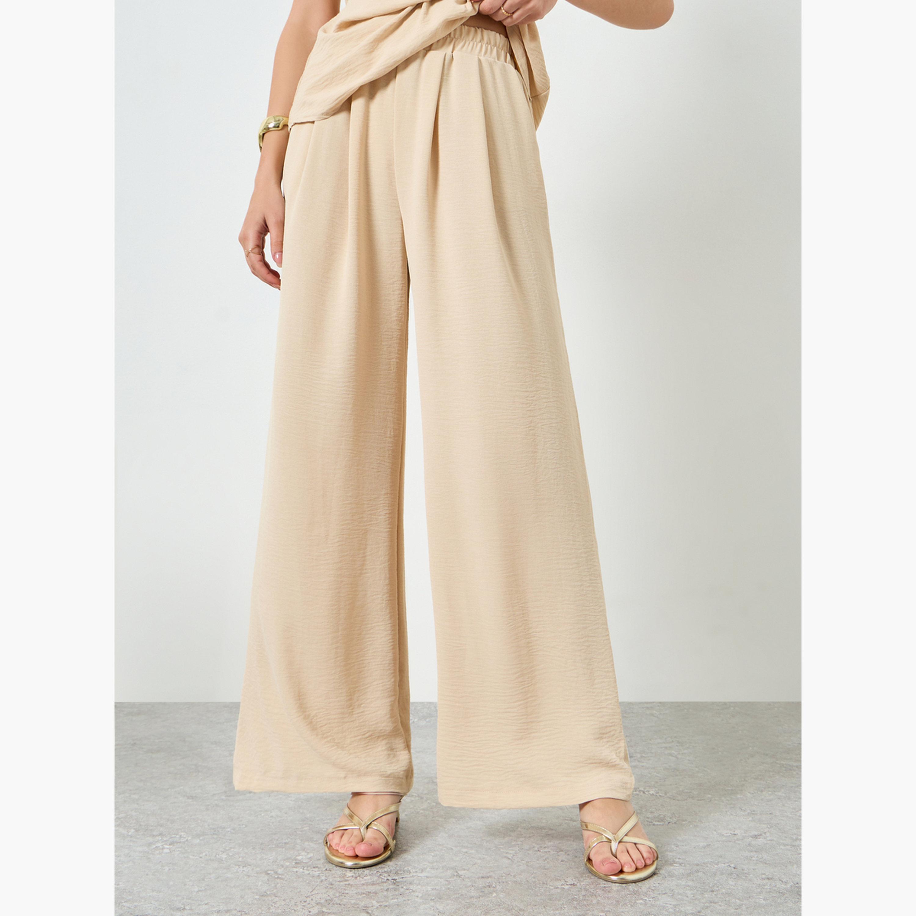 ستايلي - طقم بلوزة بدون أكمام بخصر مكشكش وبنطال واسع الساقين لون بيج-women-clothing-coordsets-image-4