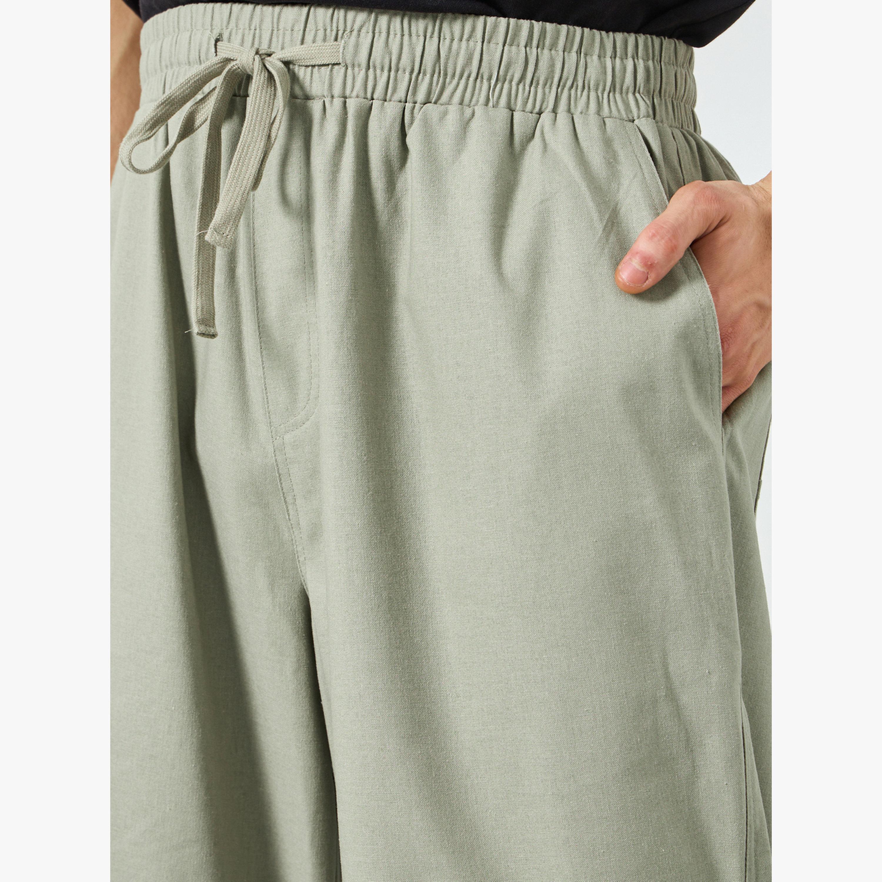 بنطال قصة مريحة من مزيج الكتان للرجال لون رمادي-men-clothing-bottoms-joggers-image-5