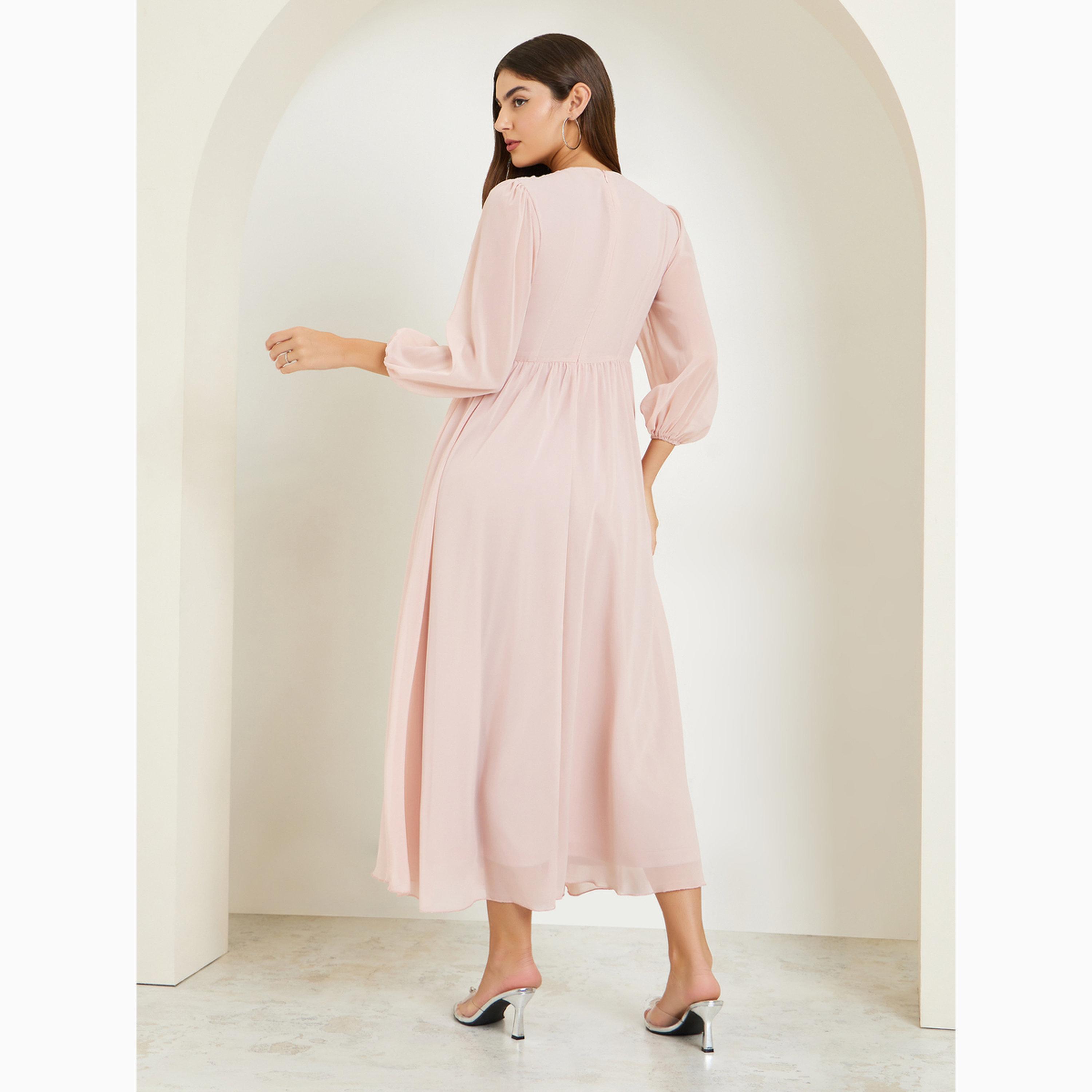 فستان طويل بحافة واسعة وأكمام منفوخة وتفاصيل مزينة-women-clothing-dresses-image-4