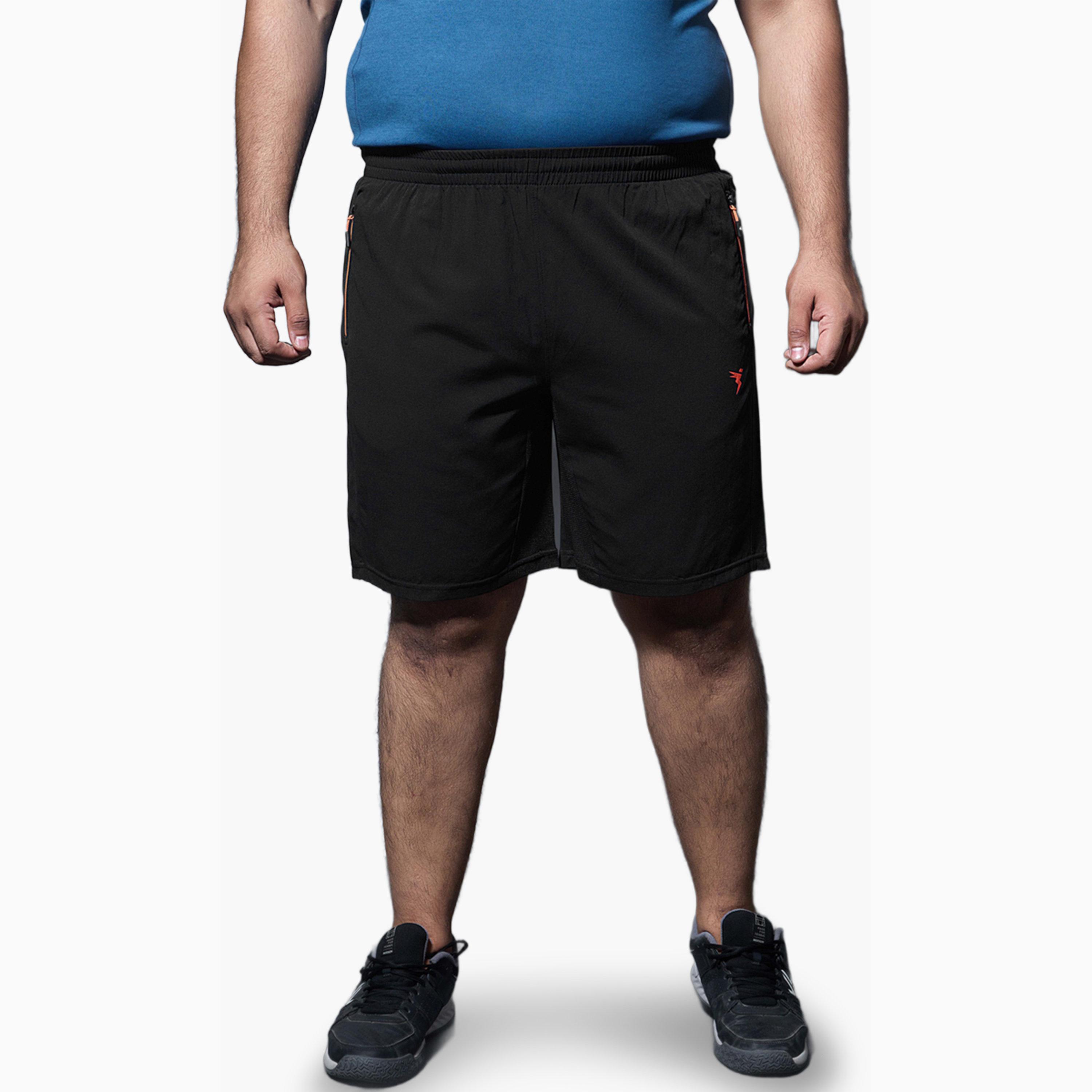 شورت رياضي سادة بقصة ضيقة للرجال مع تكنولايت-men-clothing-sportswearandactivewear-bottoms-shorts-image-1