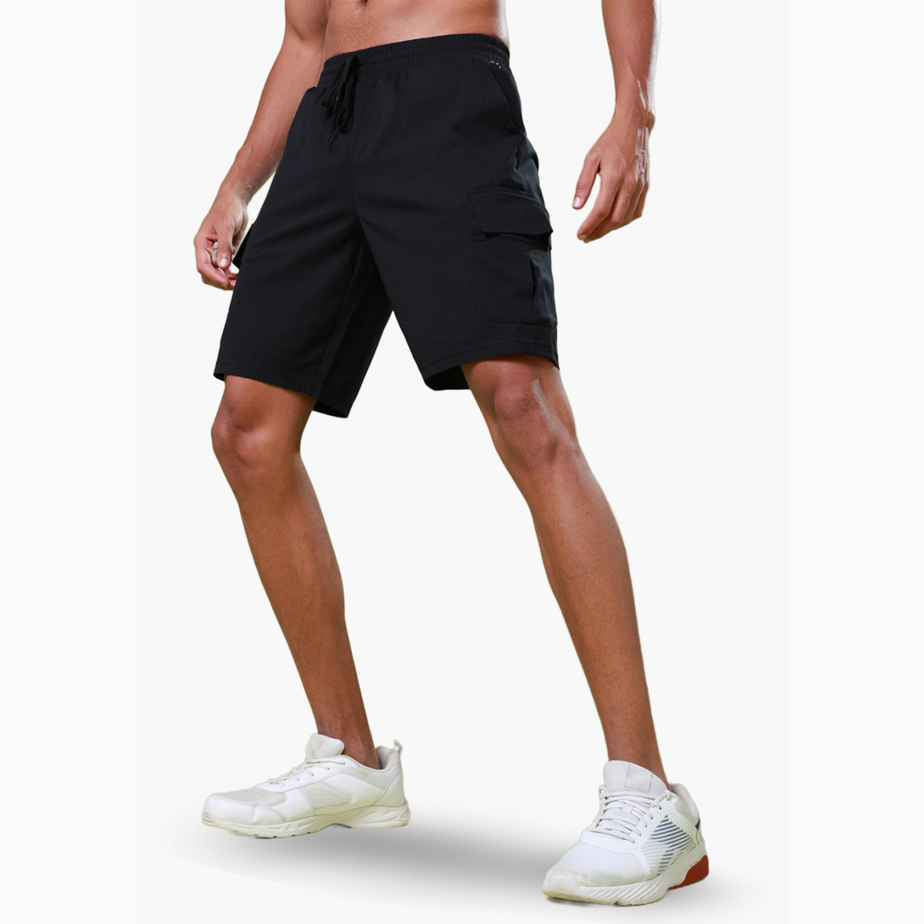 شورت رياضي سادة بقصة ضيقة للرجال وتقنية تكنوسبورت-men-clothing-sportswearandactivewear-bottoms-shorts-image-4