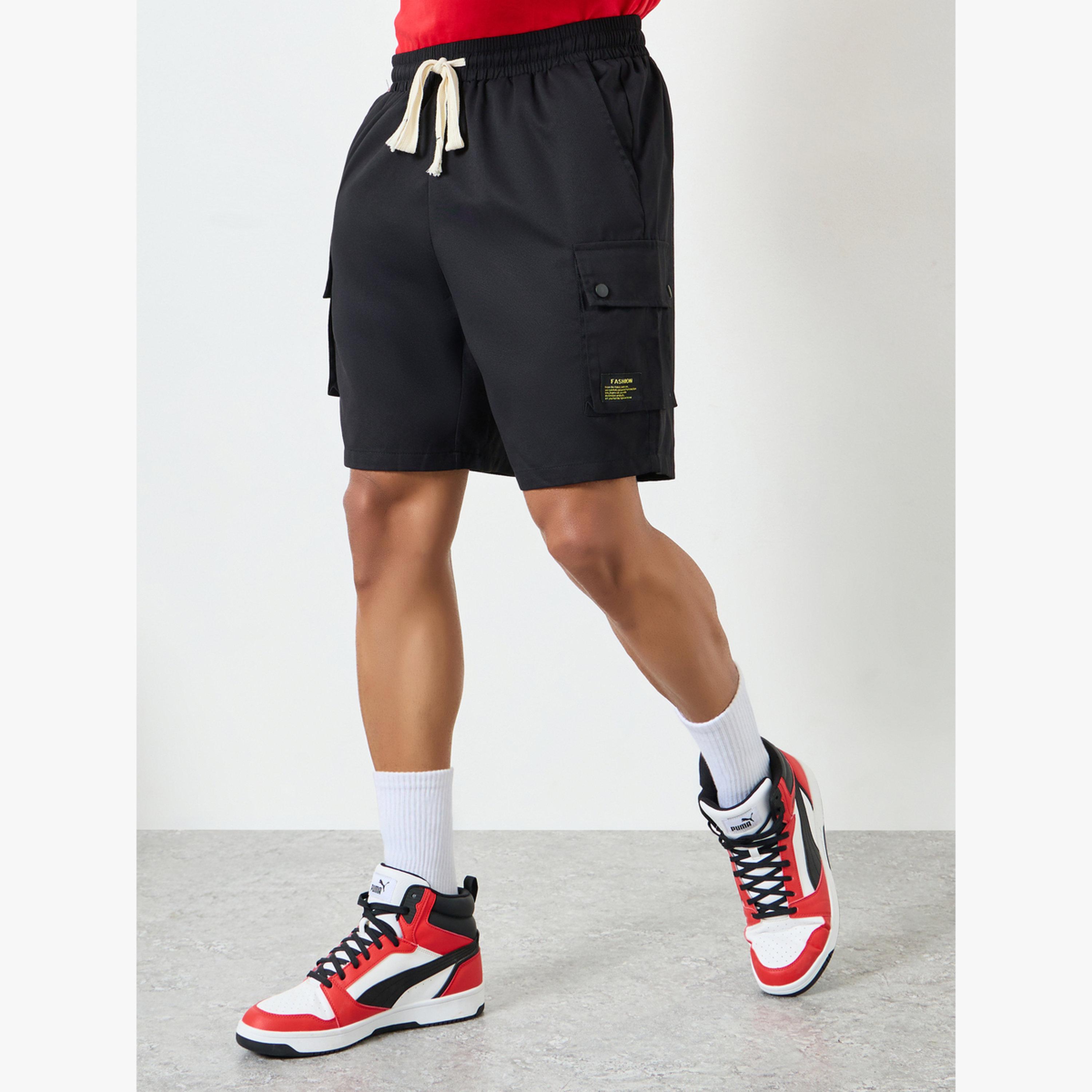 شورت سادة بتفاصيل جيوب-men-clothing-swimandbeach-shorts-image-1