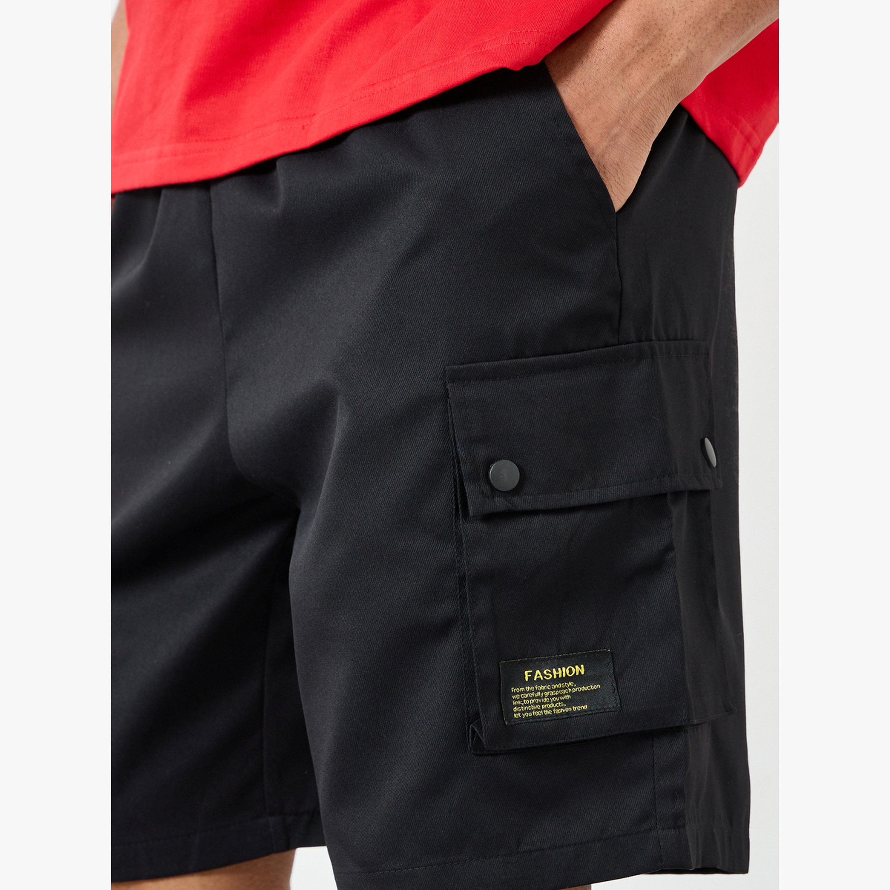 شورت سادة بتفاصيل جيوب-men-clothing-swimandbeach-shorts-image-4