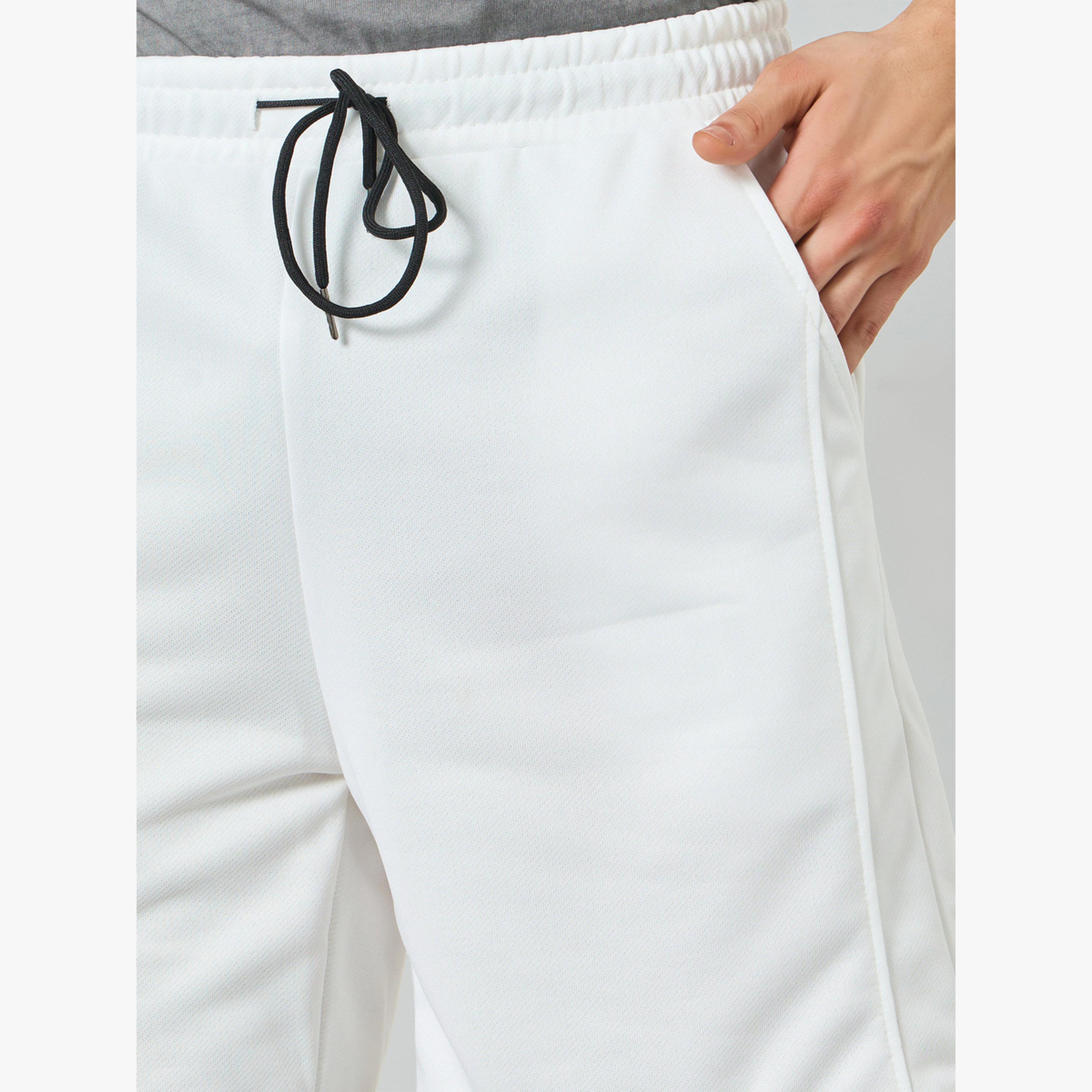 شورت مريح سادة بخصر برباط-men-clothing-swimandbeach-shorts-image-2