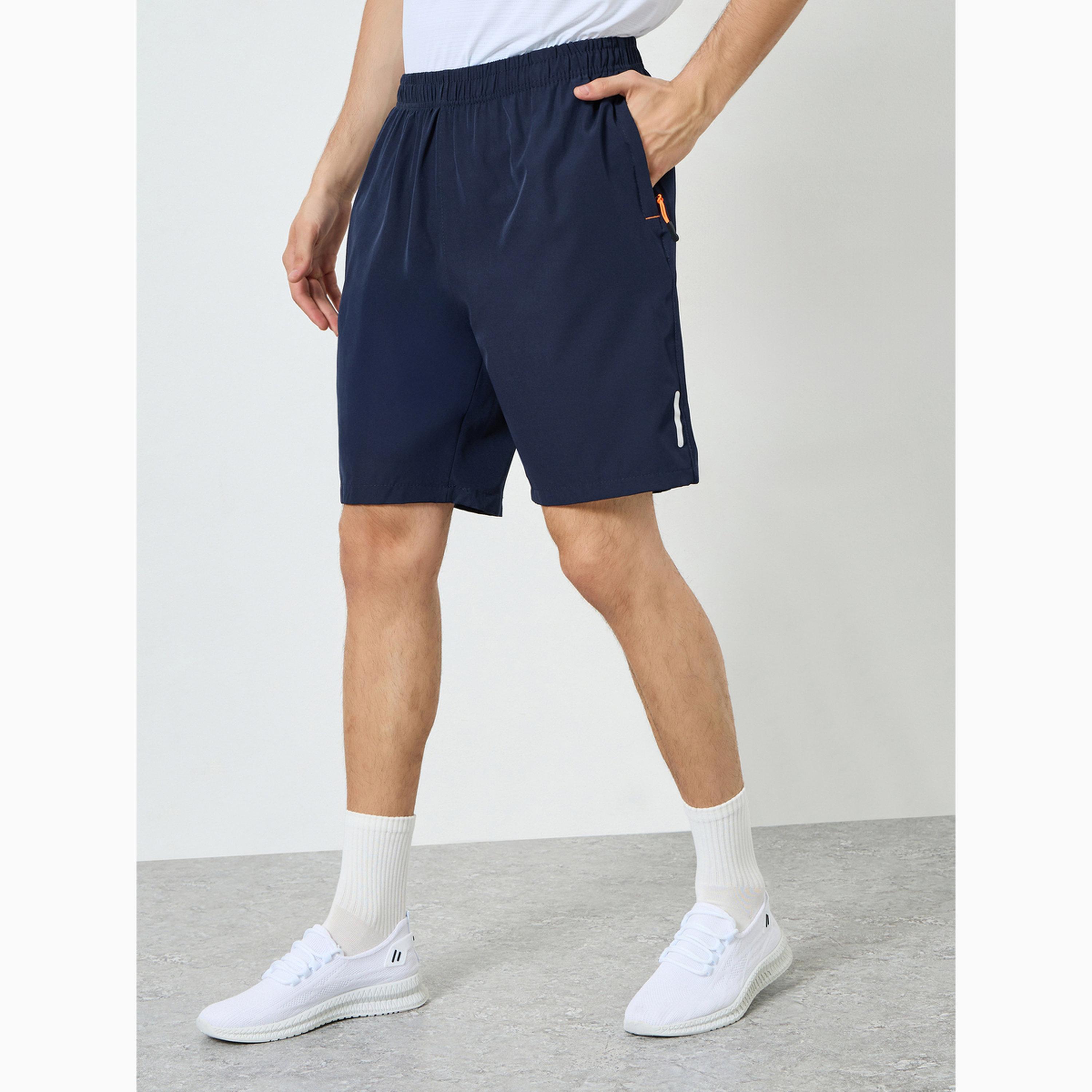 شورت رياضي للتدريب بطبعة عاكسة مع جيب بسحَّاب-men-clothing-bottoms-shorts-image-1