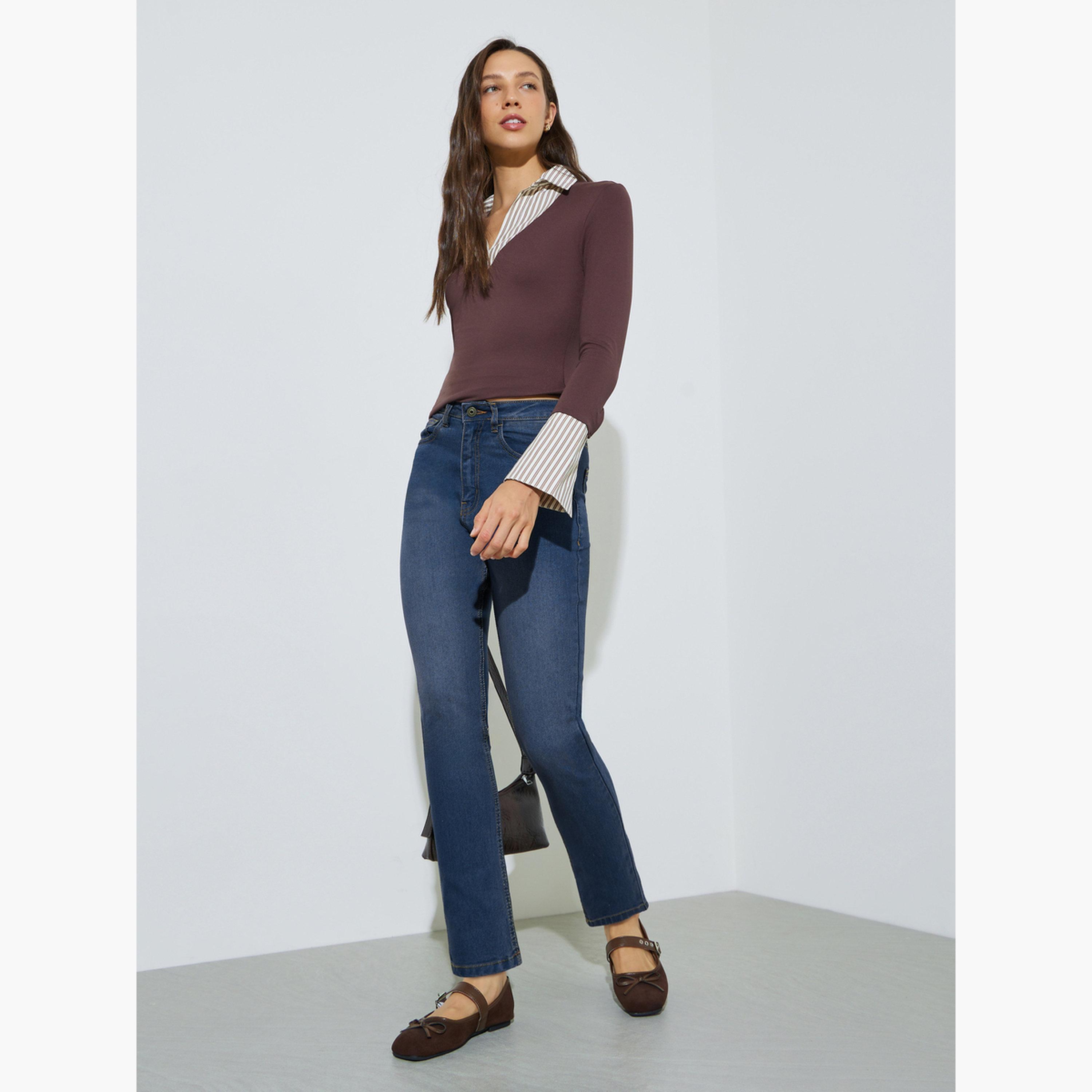 جينز بقصة ضيقة وطول الكاحل بغسيل باهت وخصر متوسط-women-clothing-jeans-image-2