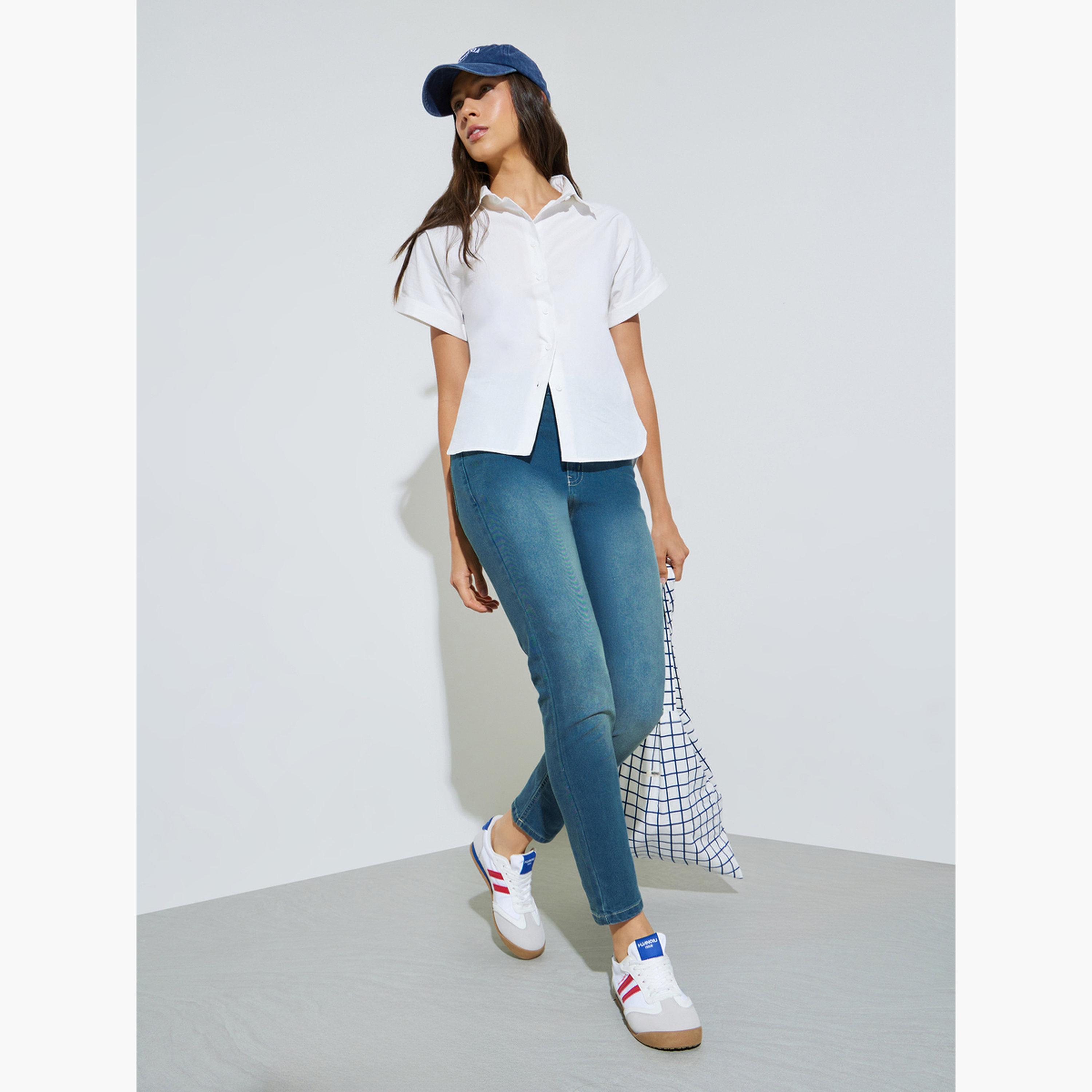 جينز بقصة ضيقة وطول الكاحل بغسيل باهت وخصر متوسط-women-clothing-jeans-image-2