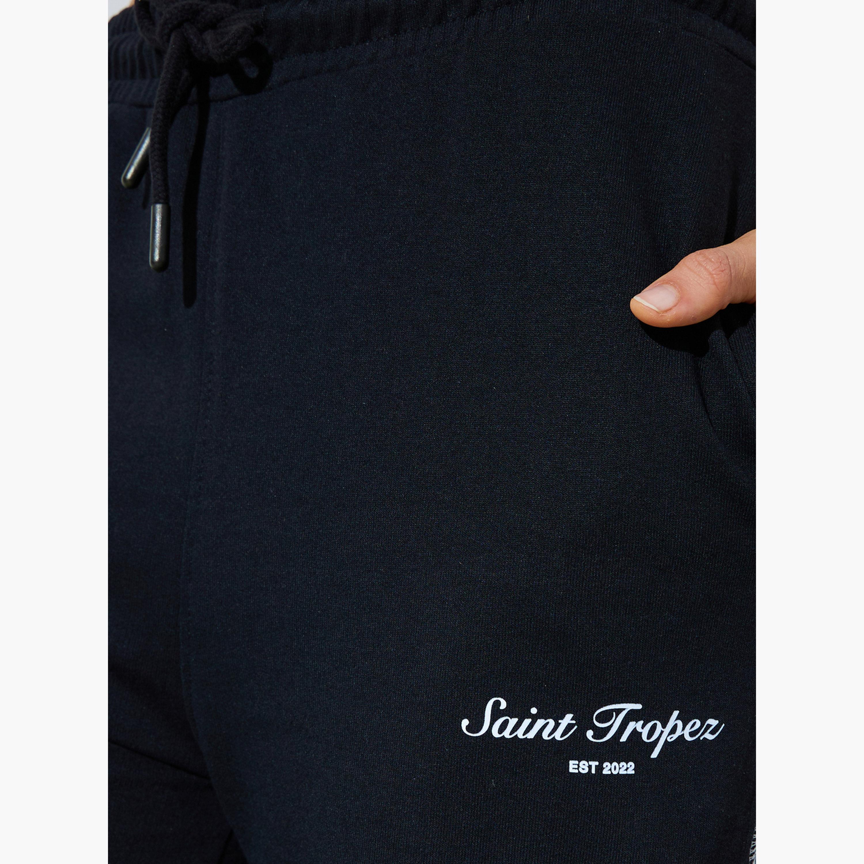 جوغر بأرجل واسعة وطبعة شعار وتطريز متقاطع لون أسود-women-clothing-bottoms-joggers-image-3