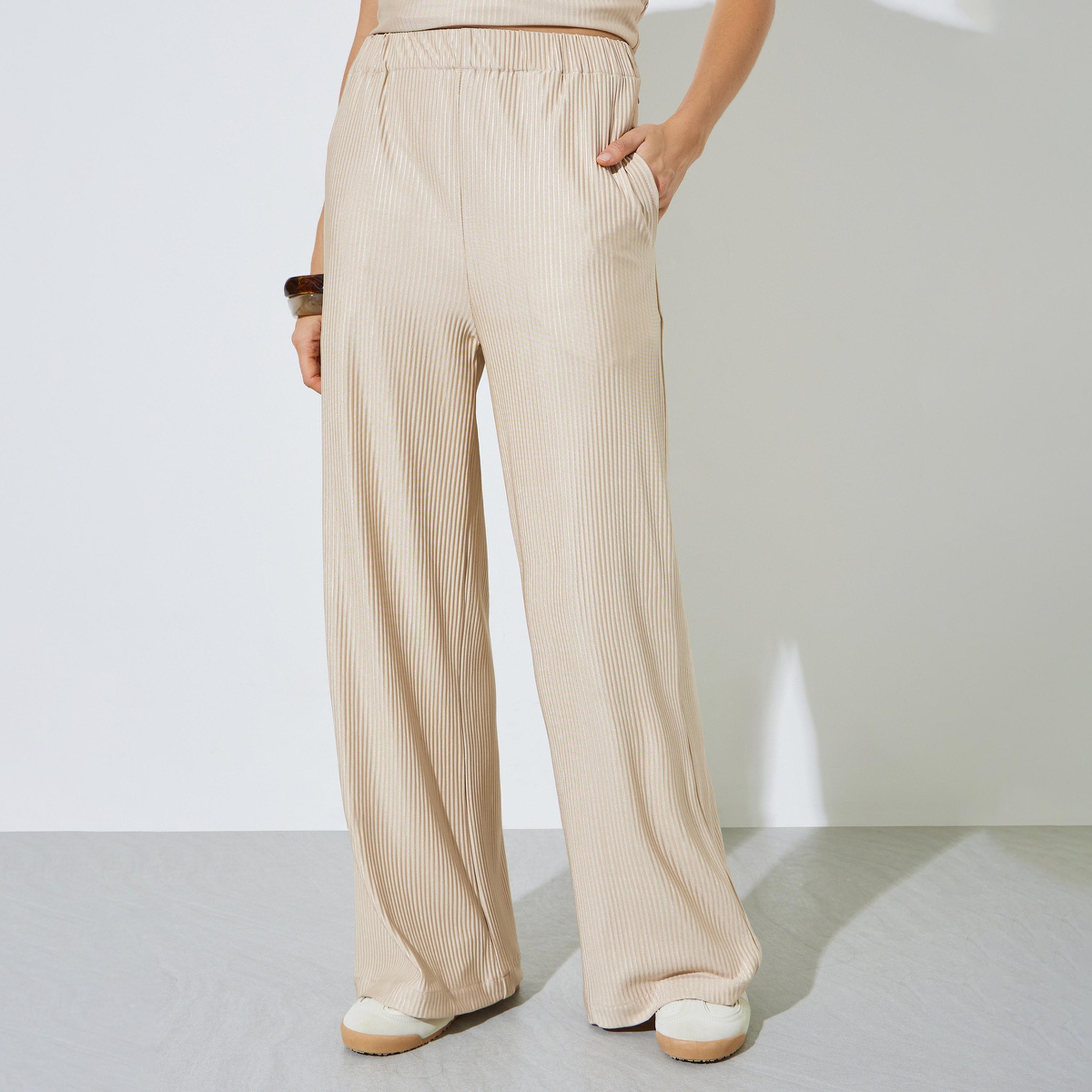 بنطال بأرجل واسعة وقماش بليسه بيج-women-clothing-bottoms-joggers-image-1