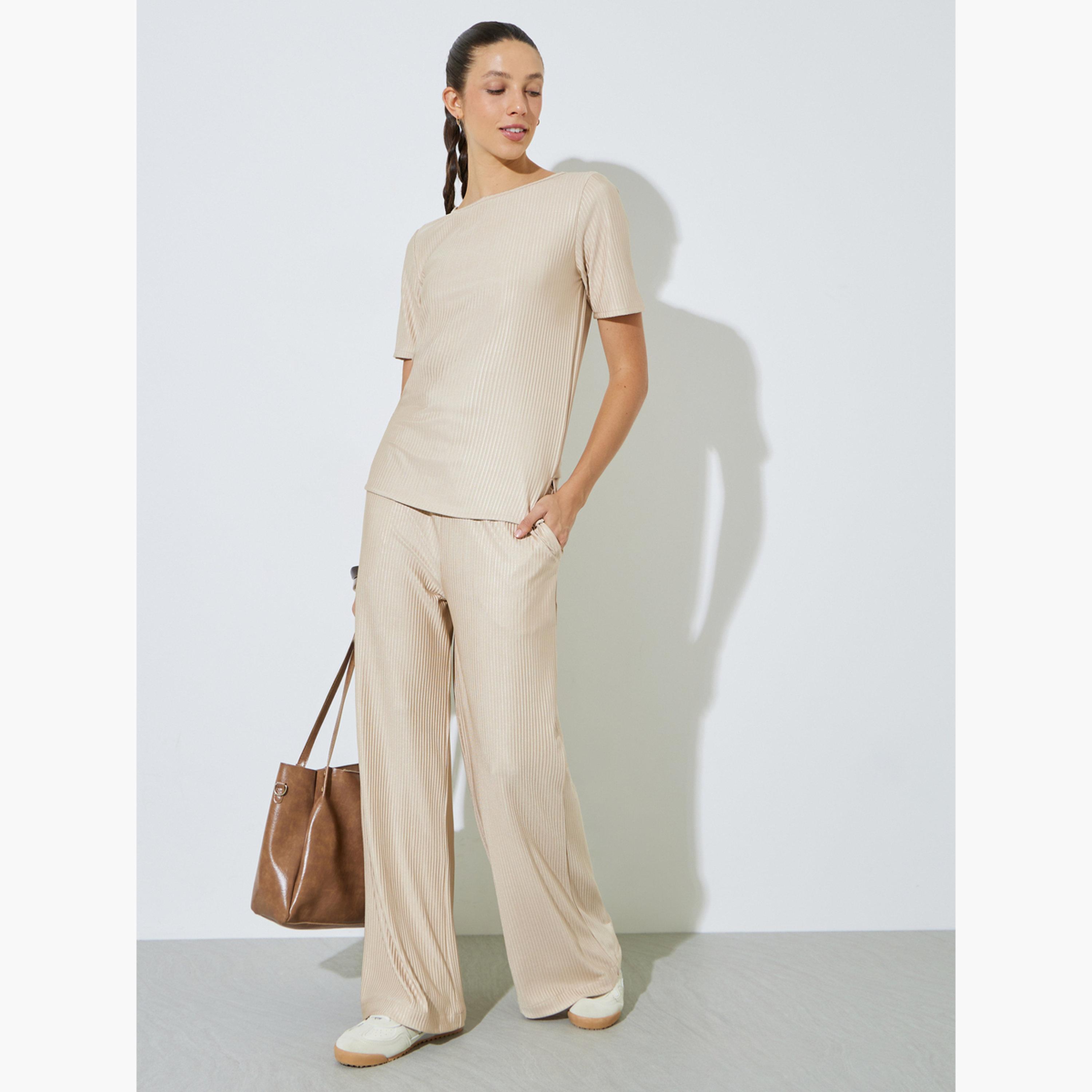 بنطال بأرجل واسعة وقماش بليسه بيج-women-clothing-bottoms-joggers-image-2