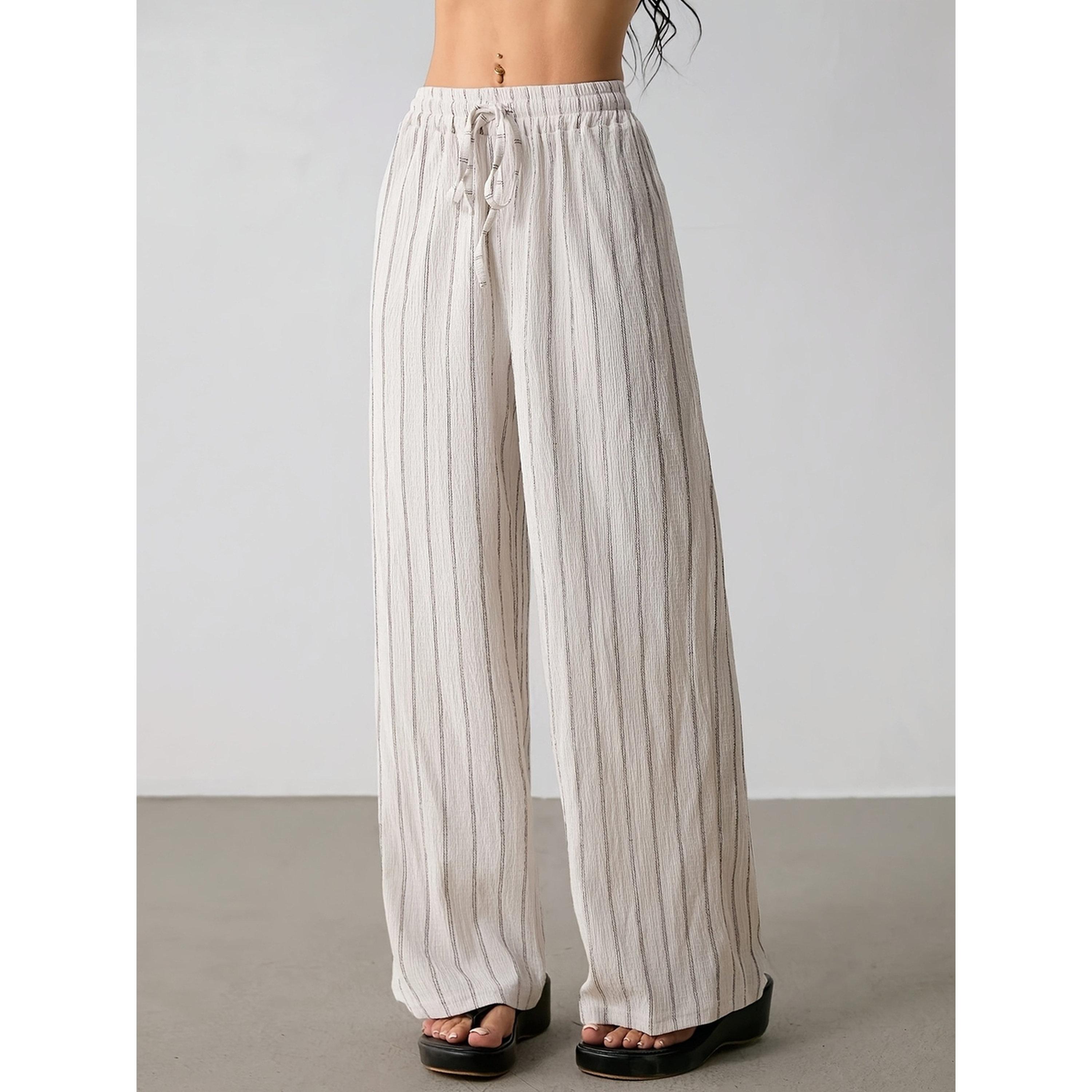 بنطال بأرجل واسعة ومخطط بلون كريمي-women-clothing-joggers-image-1