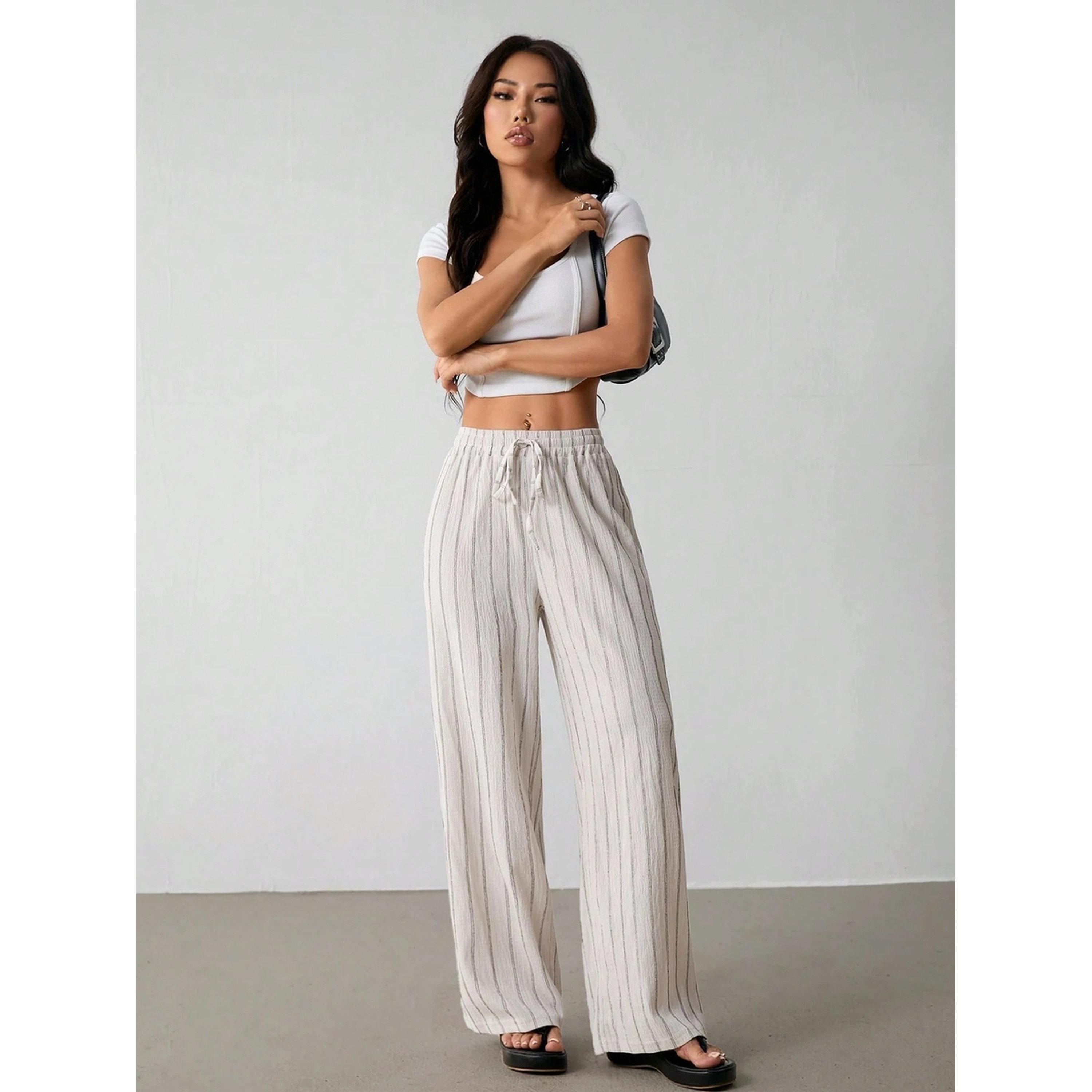 بنطال بأرجل واسعة ومخطط بلون كريمي-women-clothing-joggers-image-2