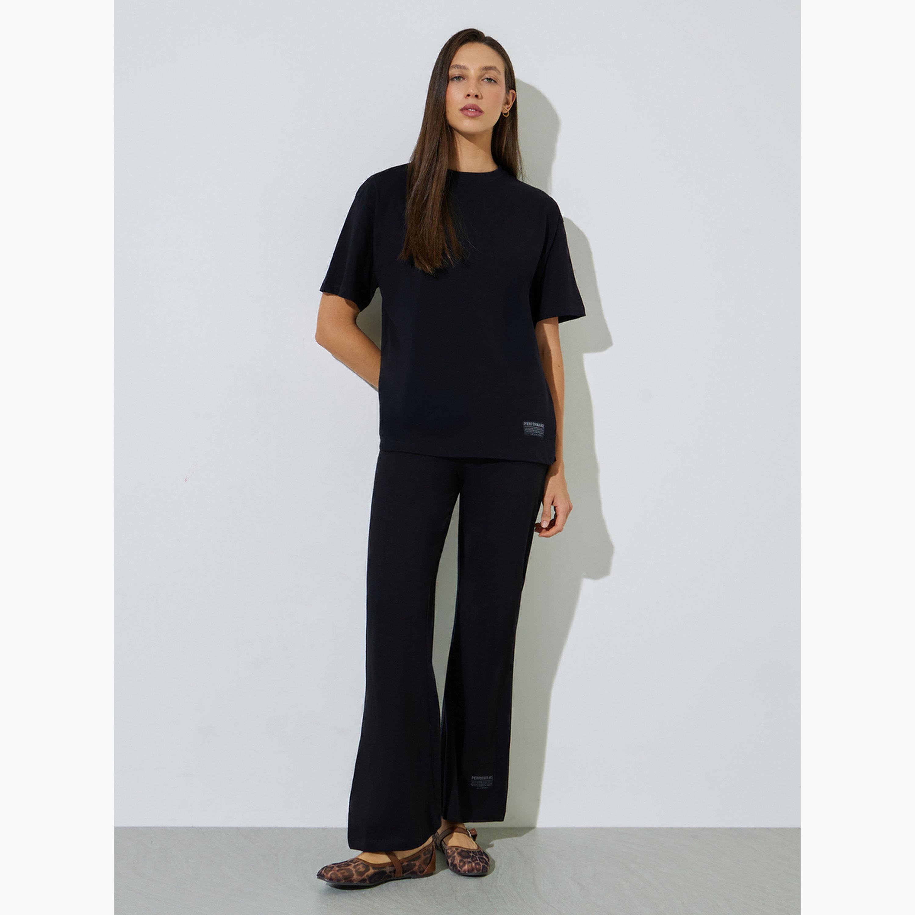 Styli Black Badge Detail T-Shirt and Flared Leggings Co-Ords-women-clothing-coordsets-image-1
