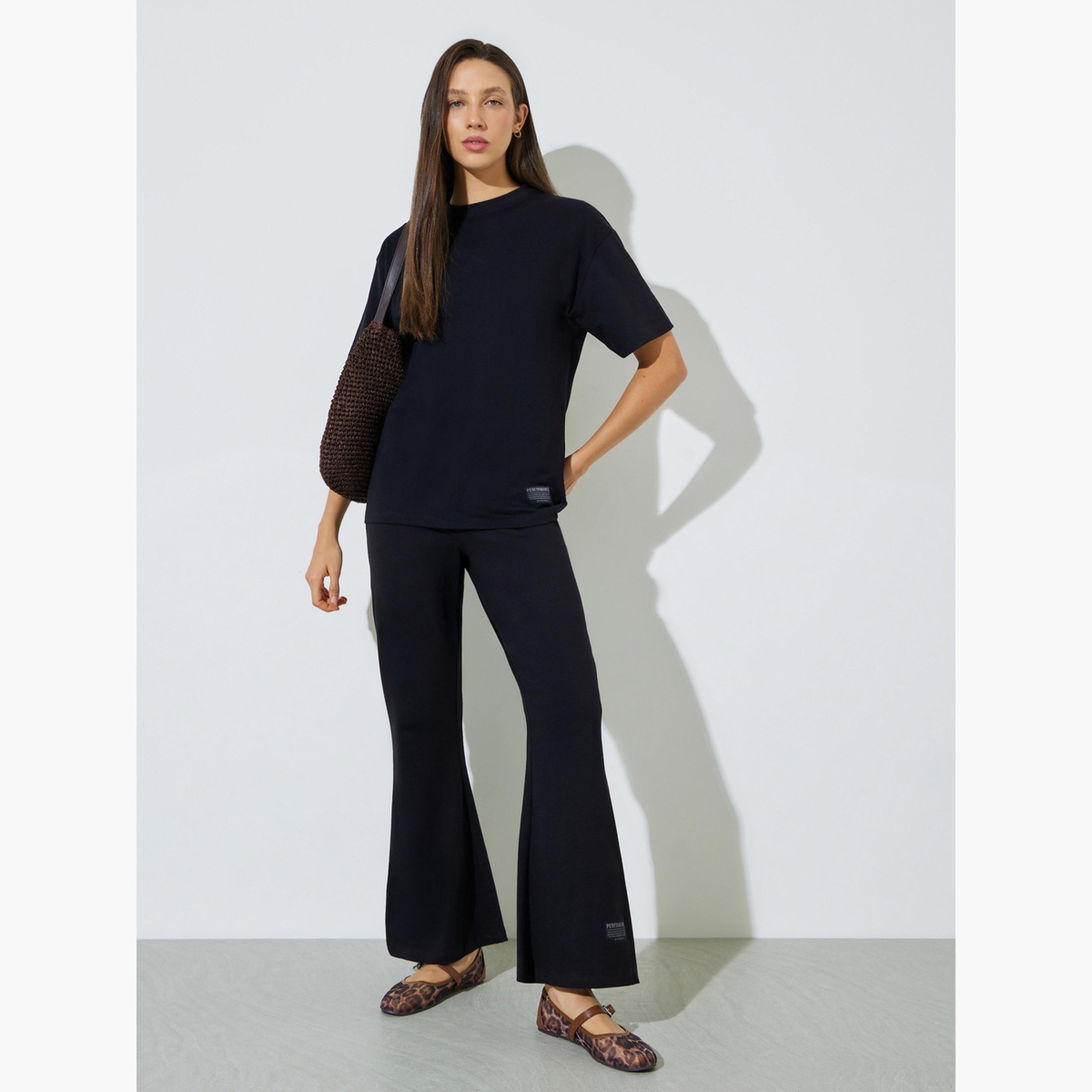 Styli Black Badge Detail T-Shirt and Flared Leggings Co-Ords-women-clothing-coordsets-image-3