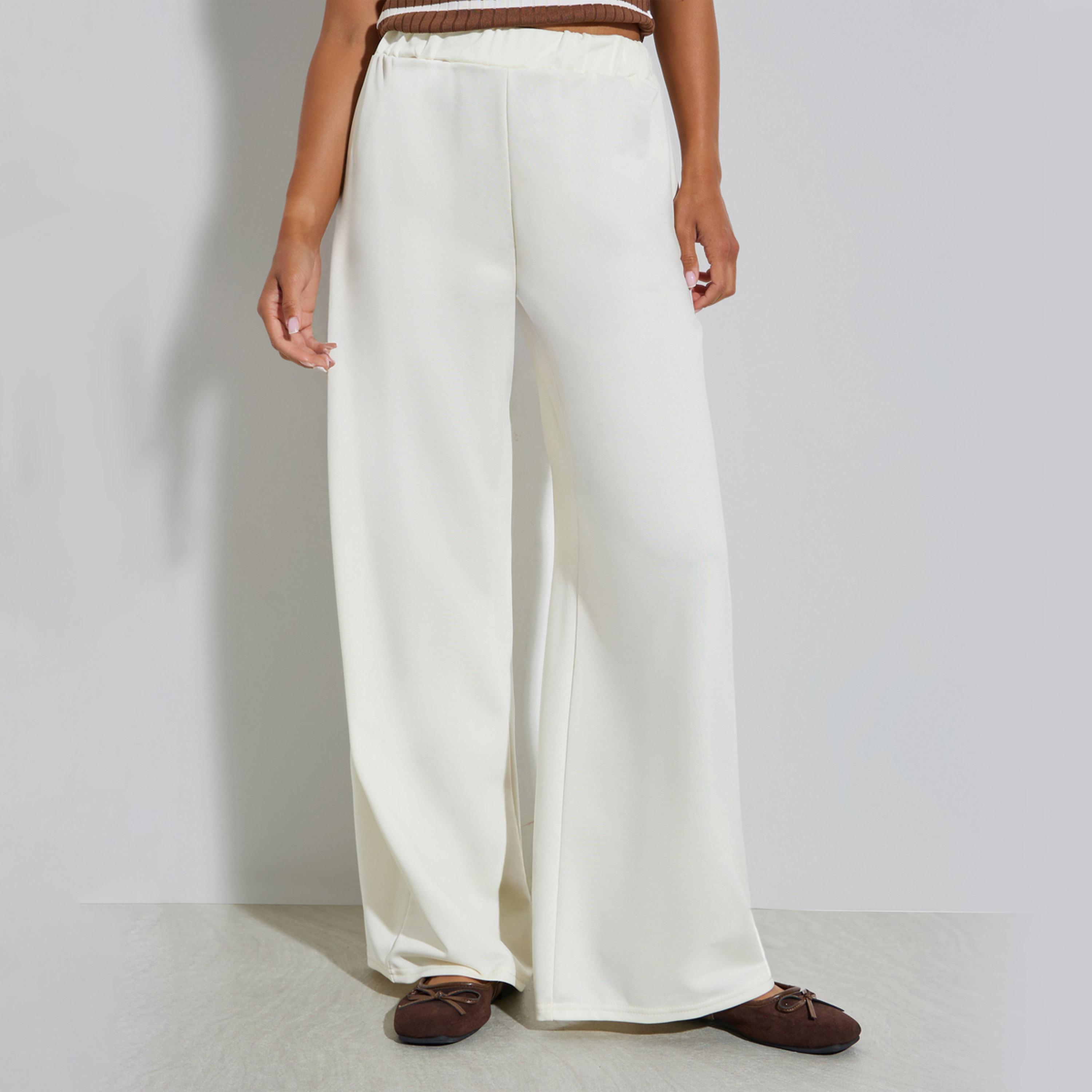 جوغر محبوك كريمي بخصر مطاطي-women-clothing-bottoms-joggers-image-1