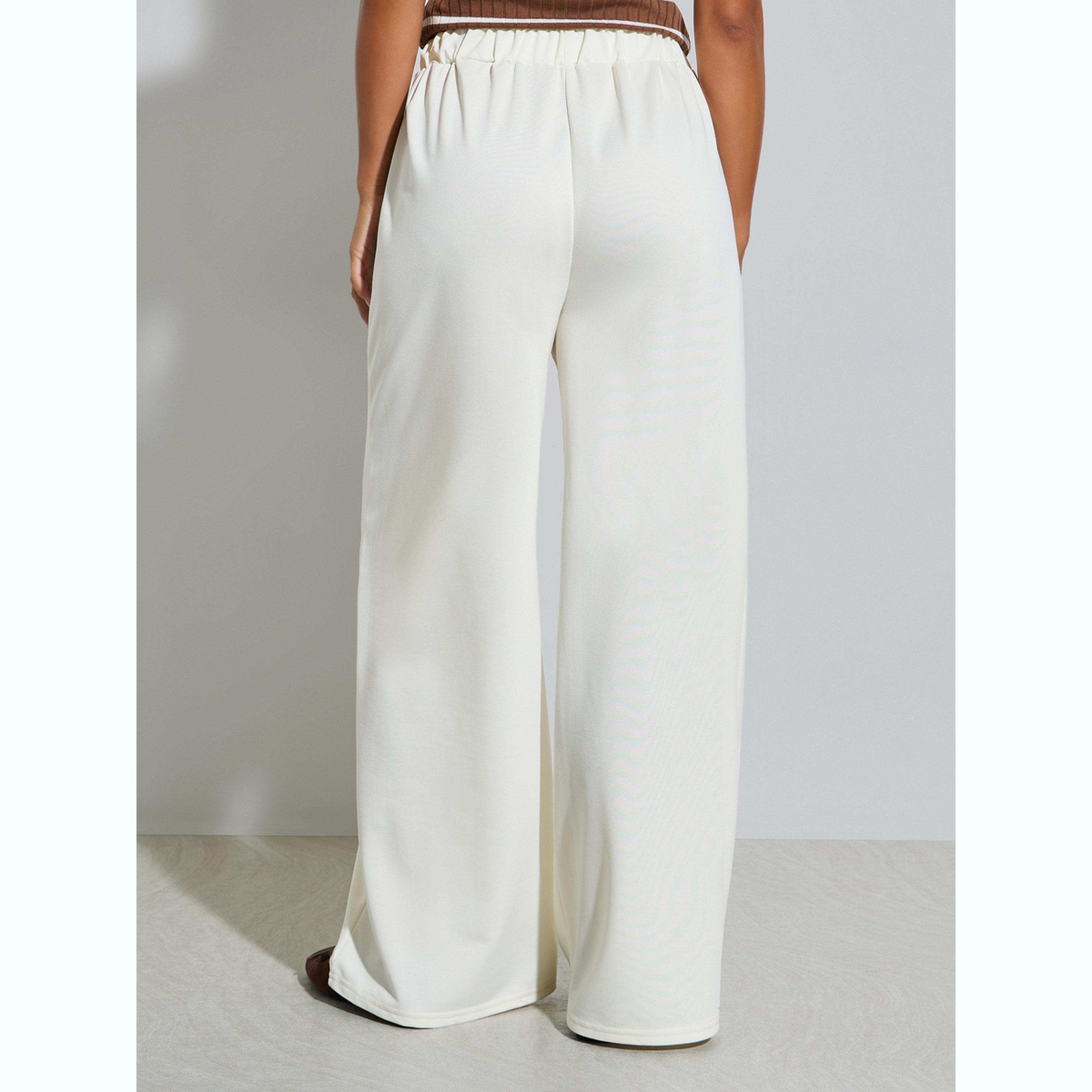جوغر محبوك كريمي بخصر مطاطي-women-clothing-bottoms-joggers-image-4