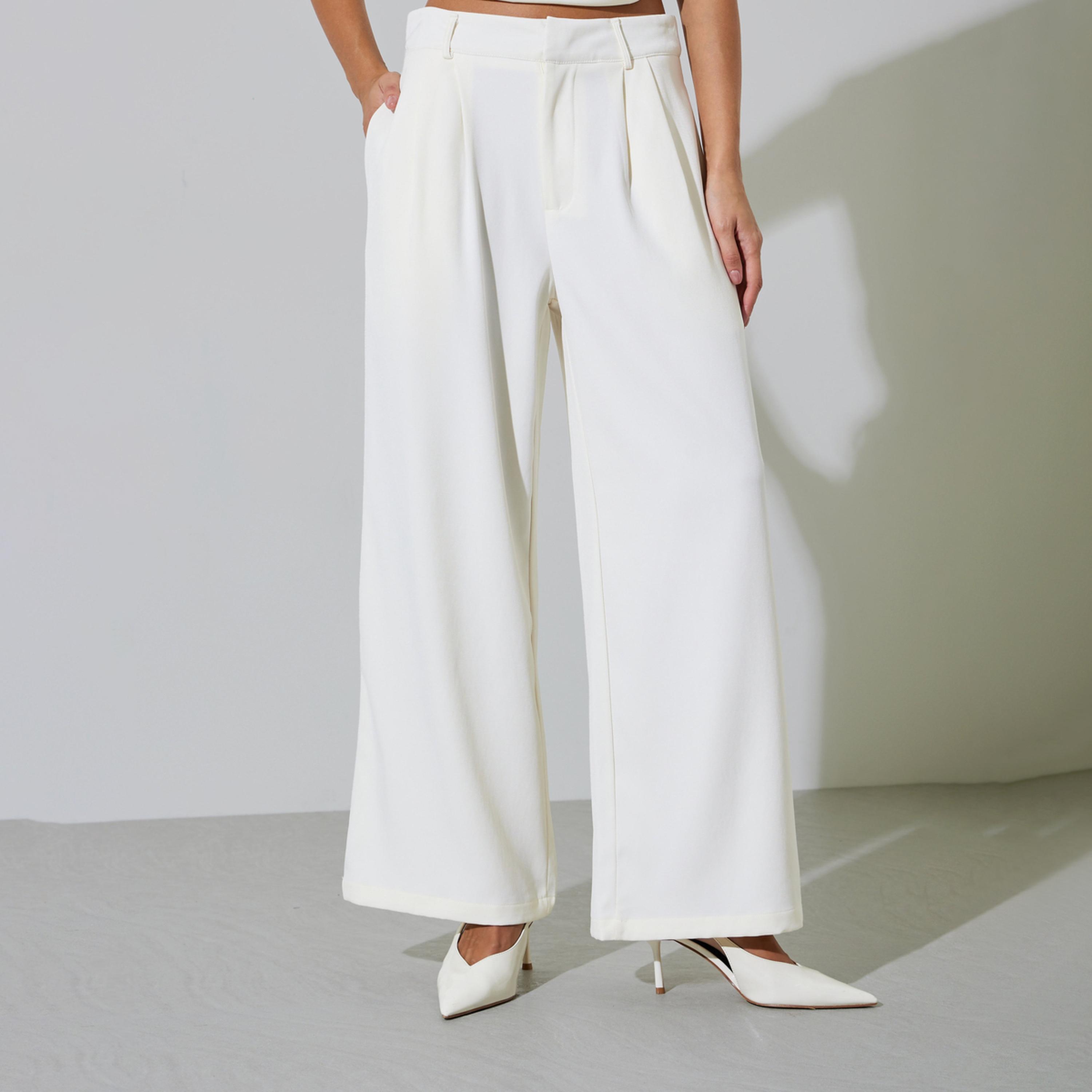 بنطال بأرجل واسعة وبكسرات بلون سادة لون أوف وايت-women-clothing-bottoms-trousers-image-1