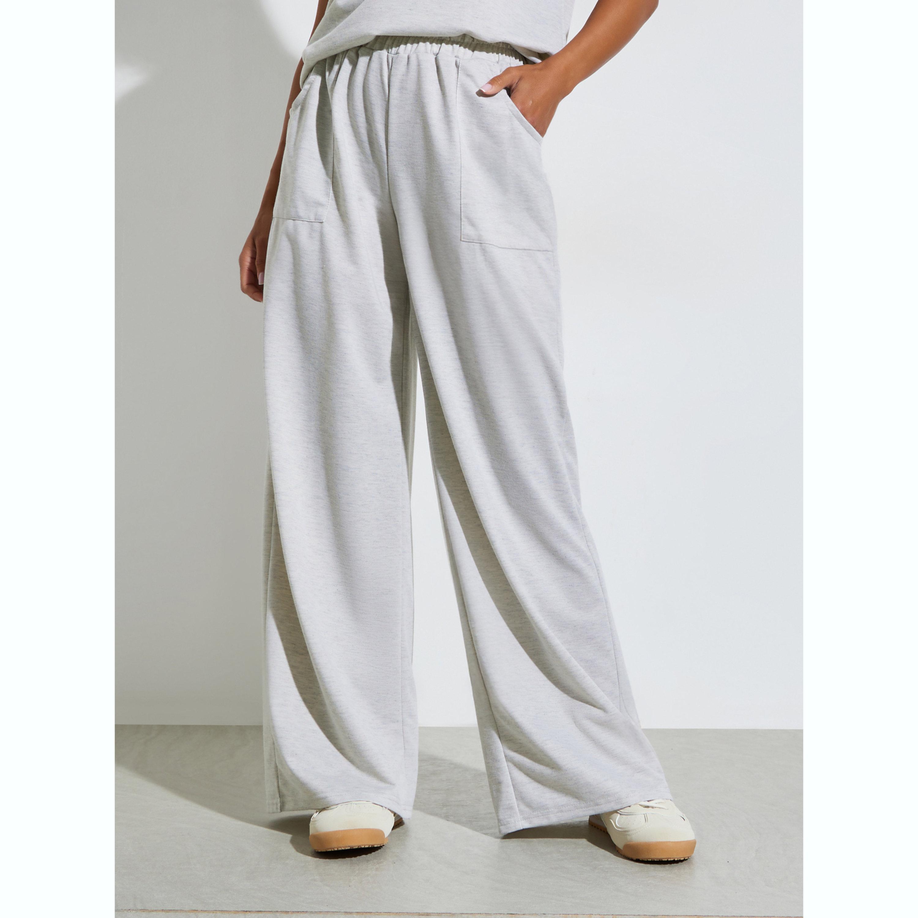 طقم منسق من جوغر بأرجل واسعة وبلوزة مريحة سادة-women-clothing-coordsets-image-5