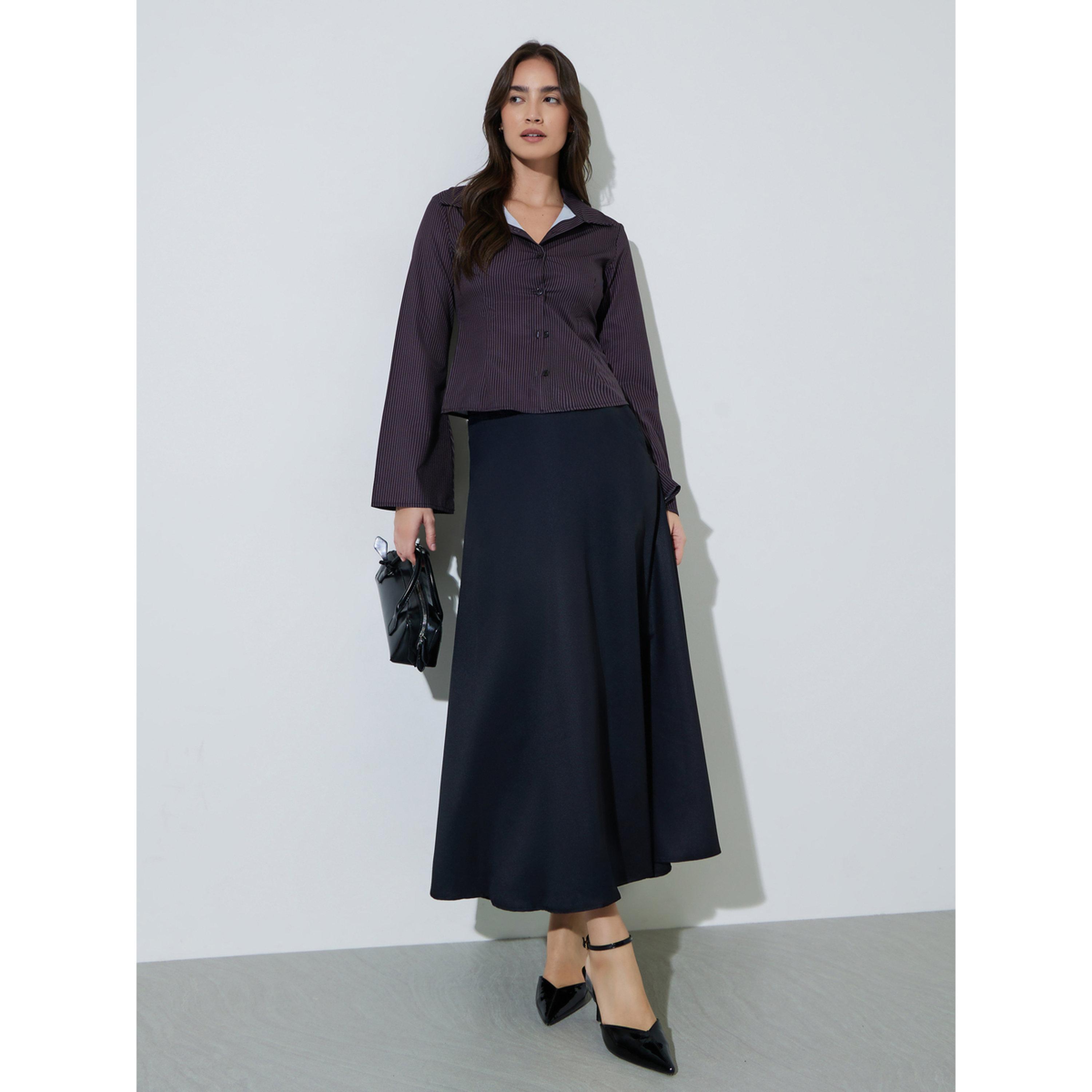 تنورة طويلة بحافة واسعة سادة وتفاصيل جيوب باللون الأسود-women-clothing-skirts-image-2